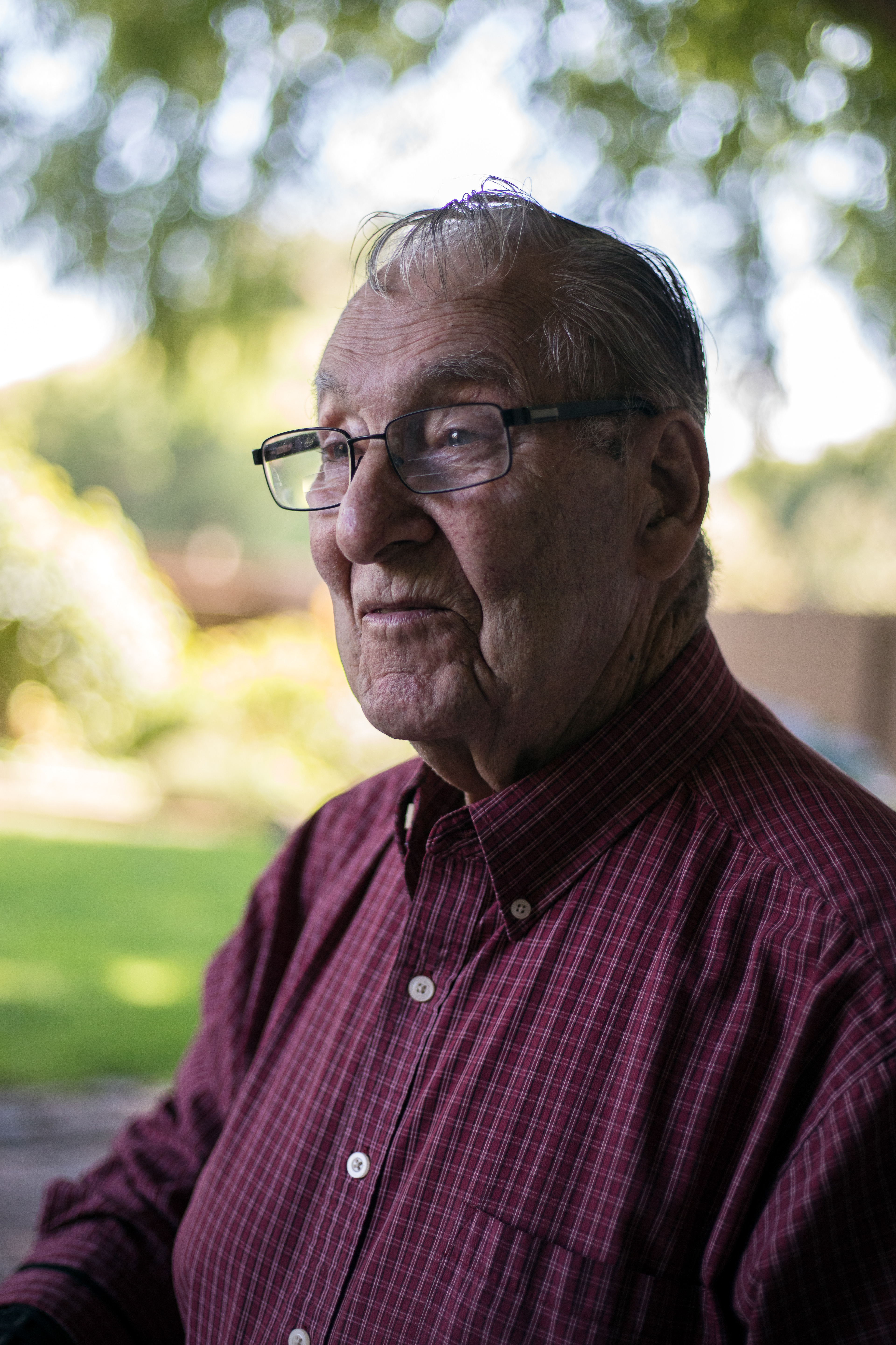 Ray Mansisidor, WWII veteran, sits and listens to his friend's old stories on Sept. 14 in Nampa.
