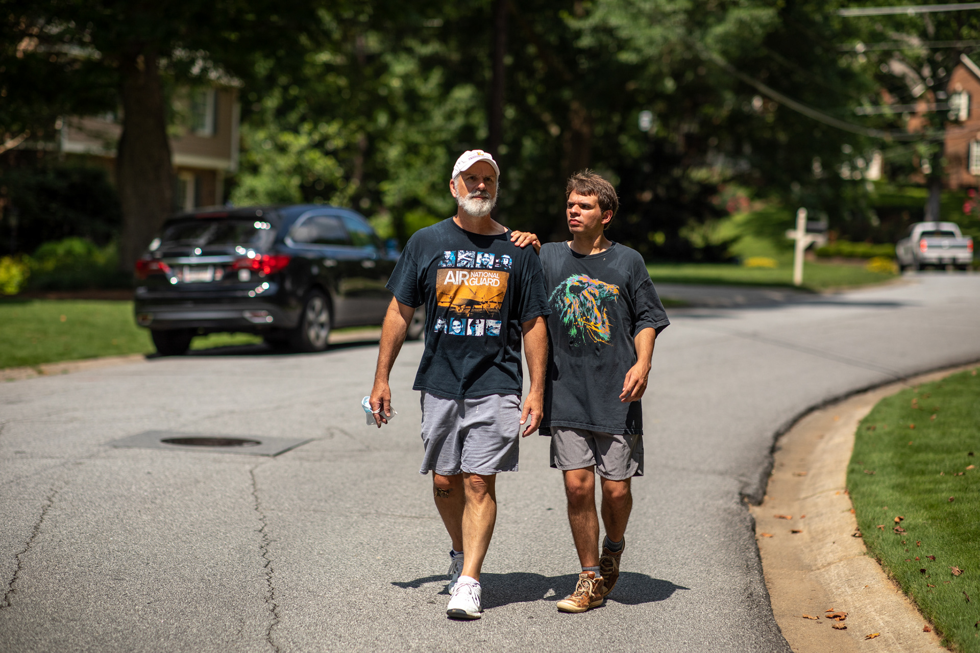 Philip and Evan Woody walk back to their house in Dunwoody after an activity at their church, the North Atlanta Church of Christ, on July 18.