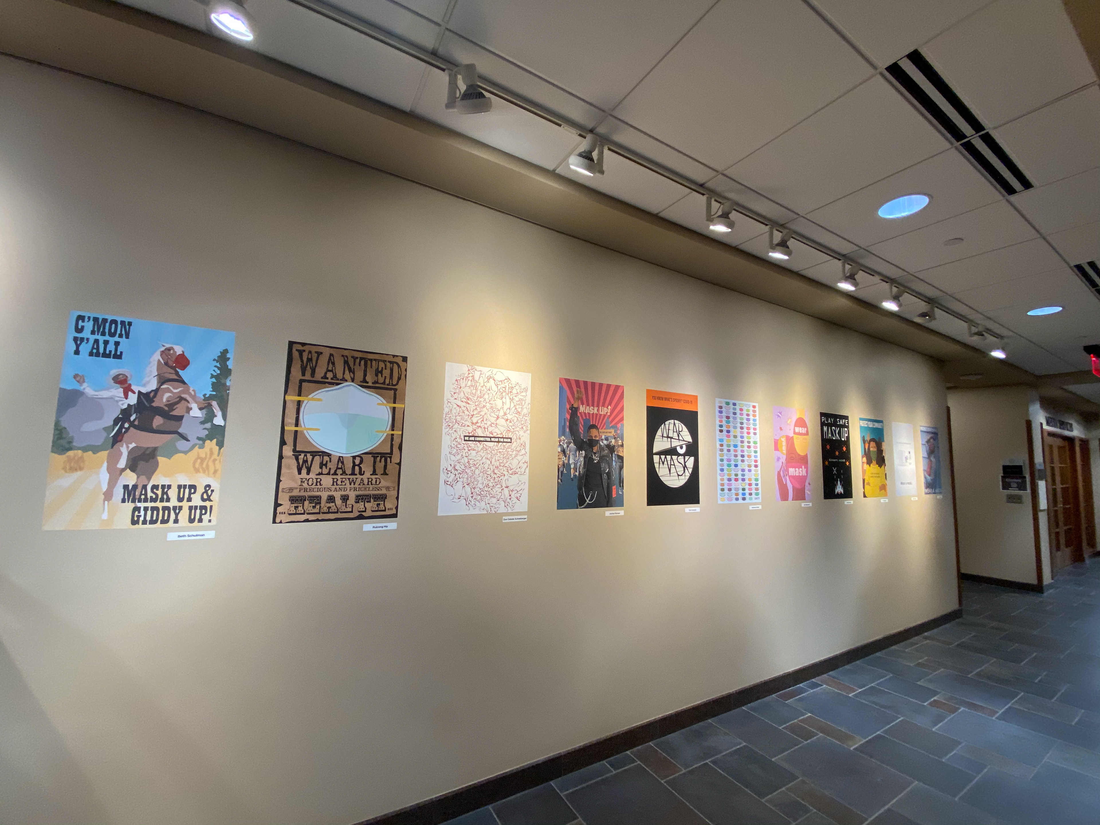 Poster (left) on display in Upjohn Library Commons
