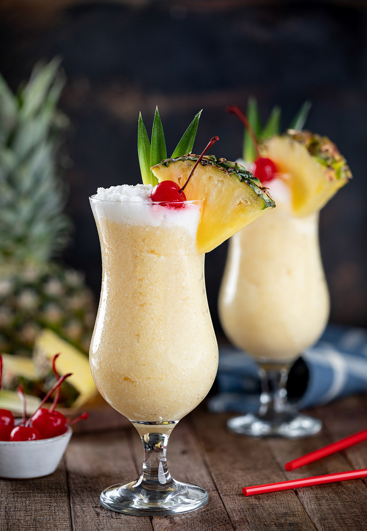Pina colada with cherry and pineapple slice