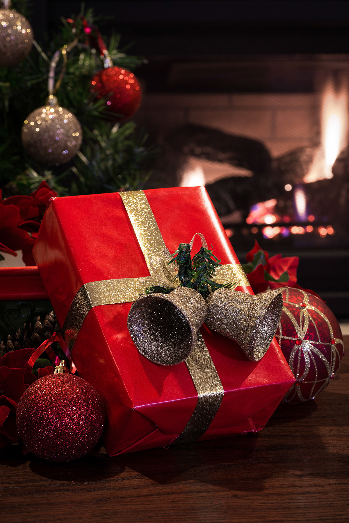 Christmas present by a fireplace