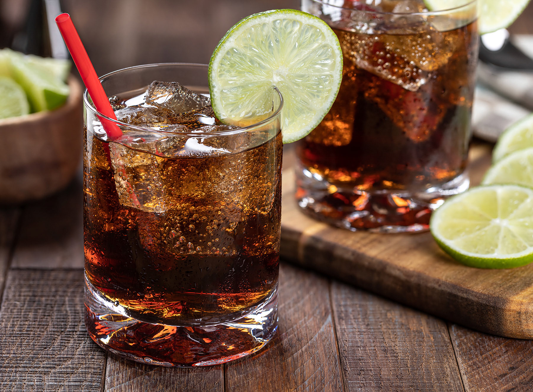 Rum and cola with lime slice