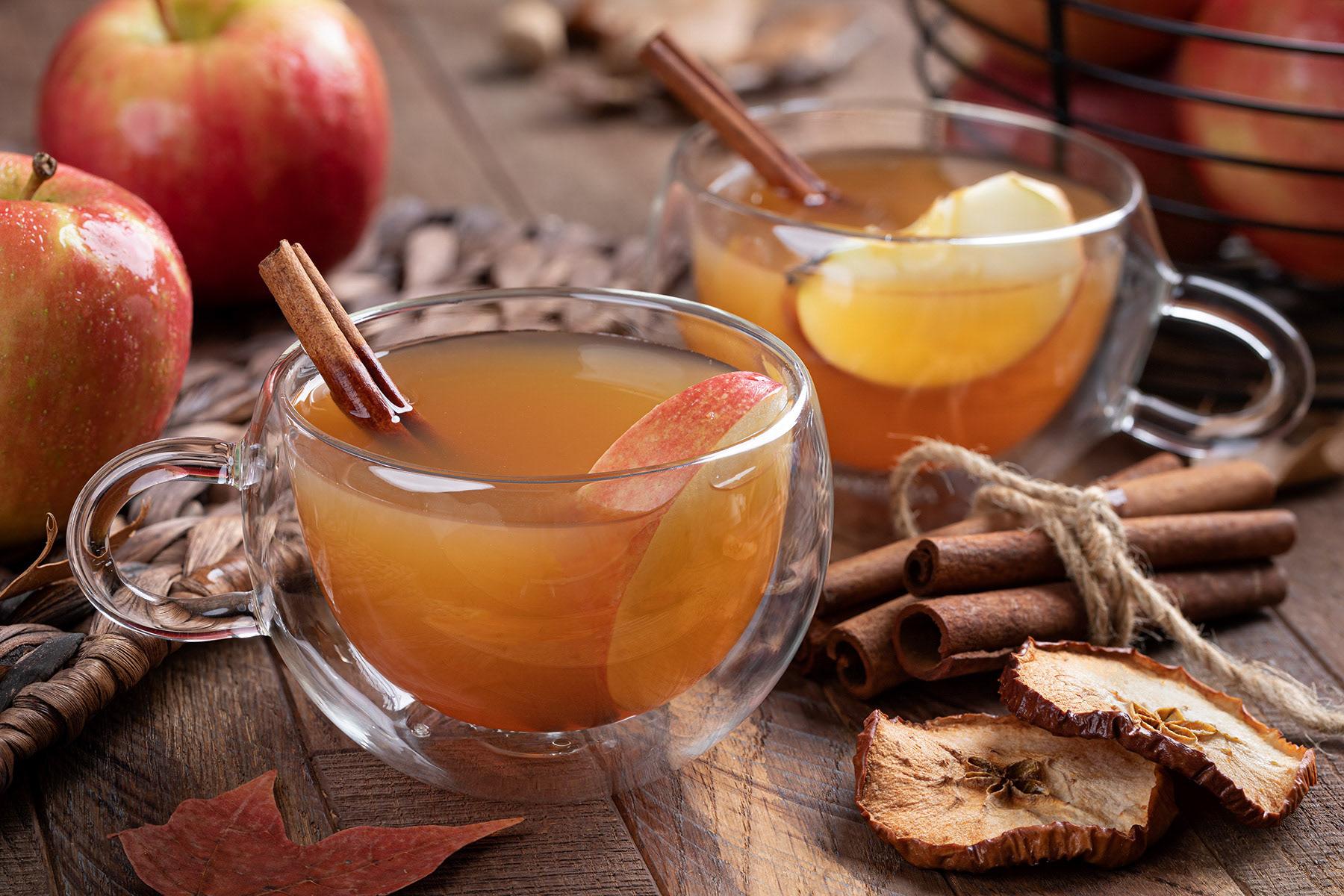Cup of apple cider with cinnamon stick