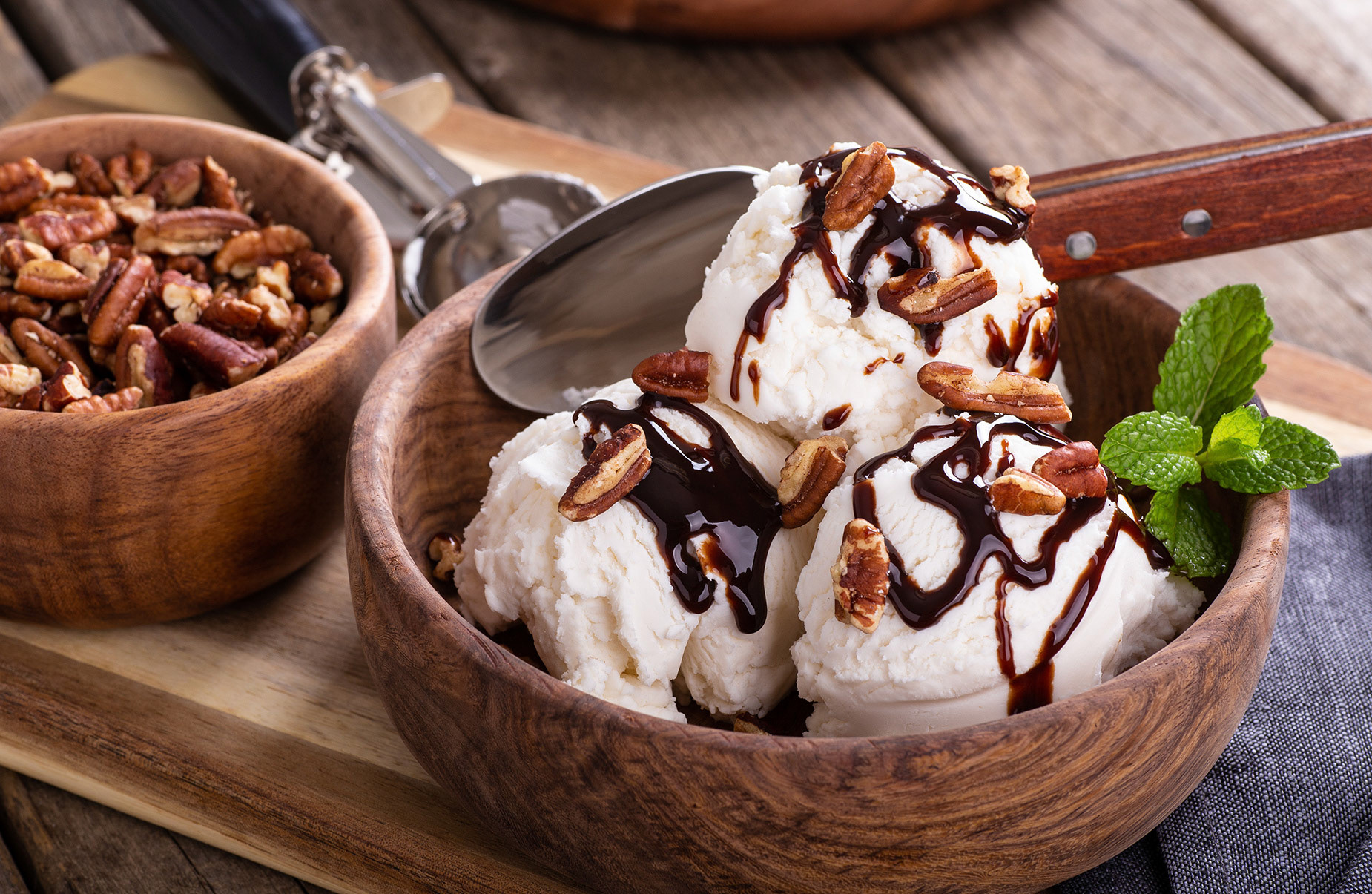 Vanilla ice cream with chocolate syrup and pecans