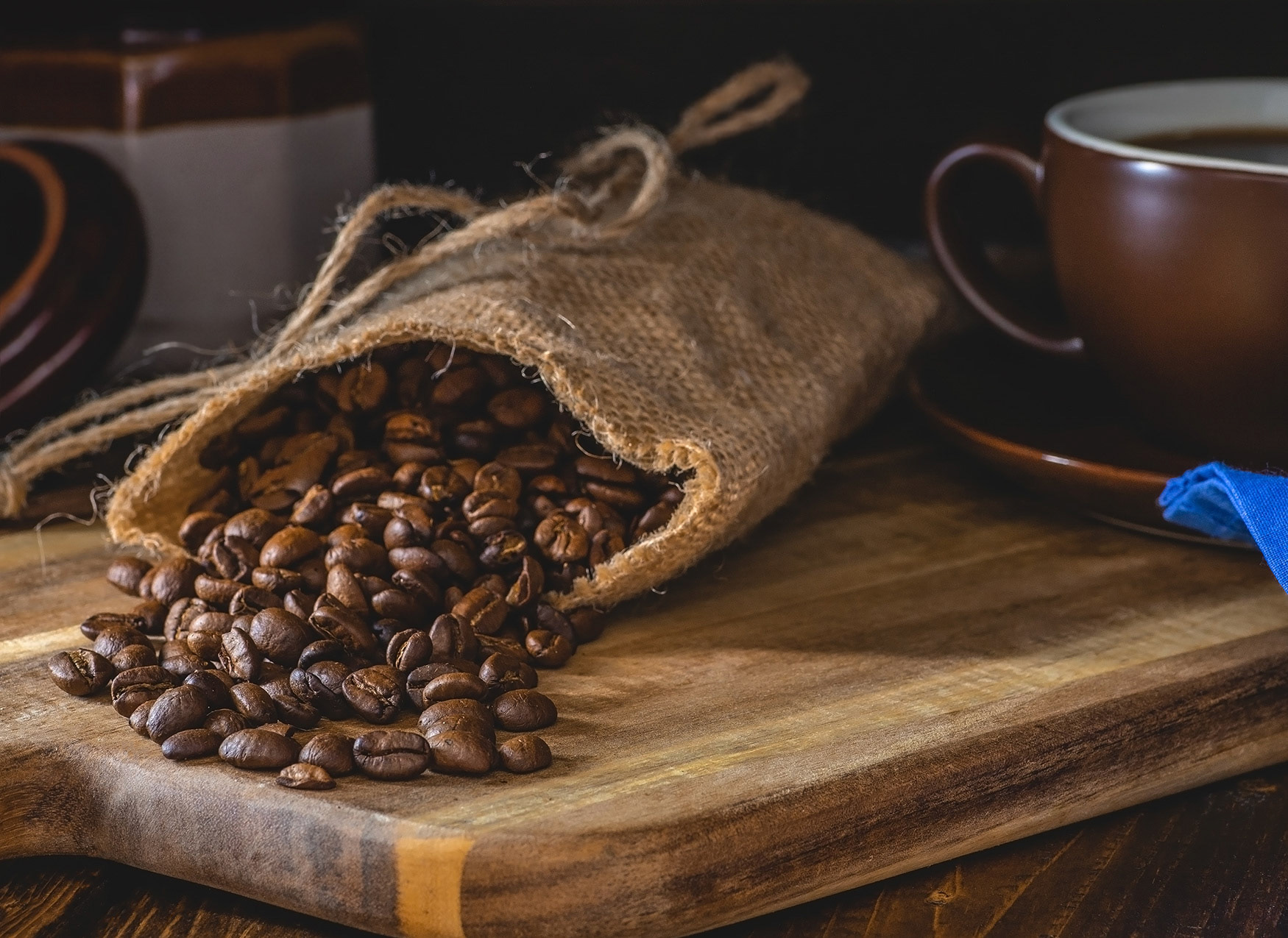 Coffee beans spilled from a burlap bag