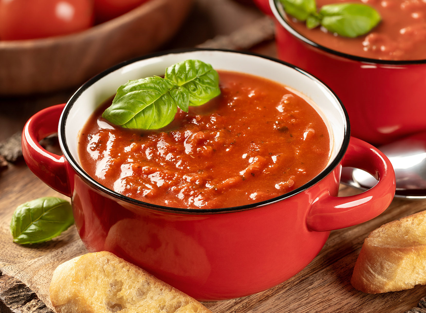 Tomato soup garnished with basil leaves