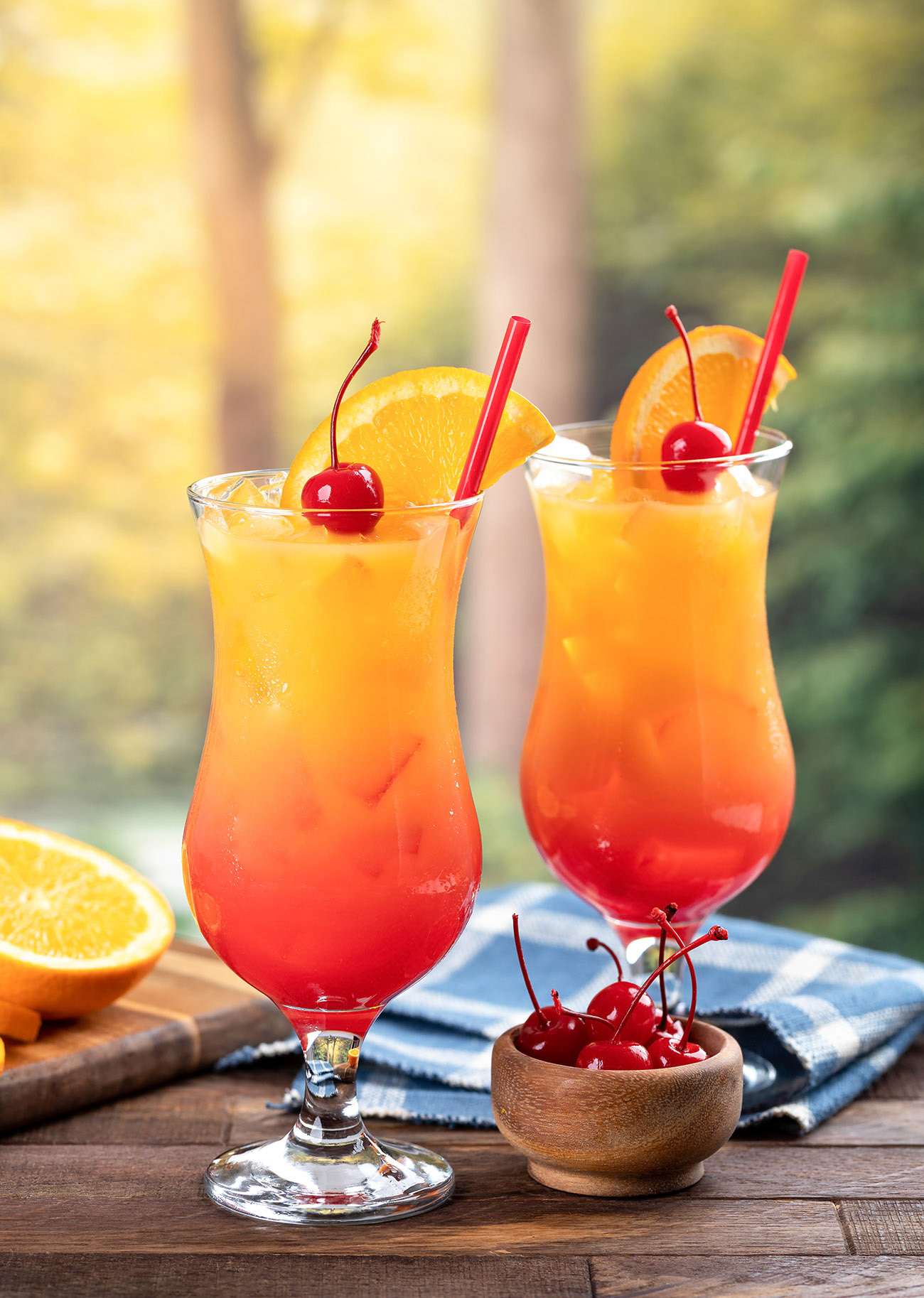 Tequila sunrise with orange slice and cherry
