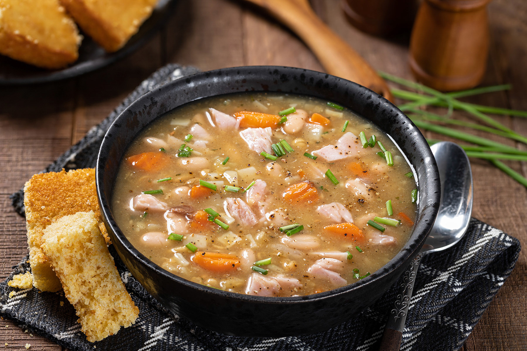 Ham and bean soup with carrots and chives