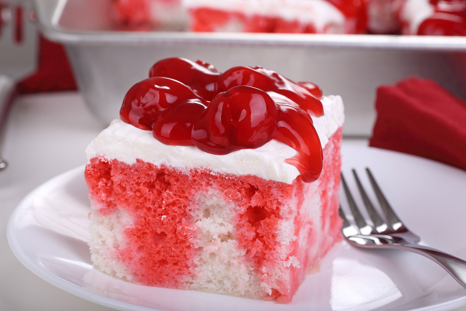 White cake with cherry topping