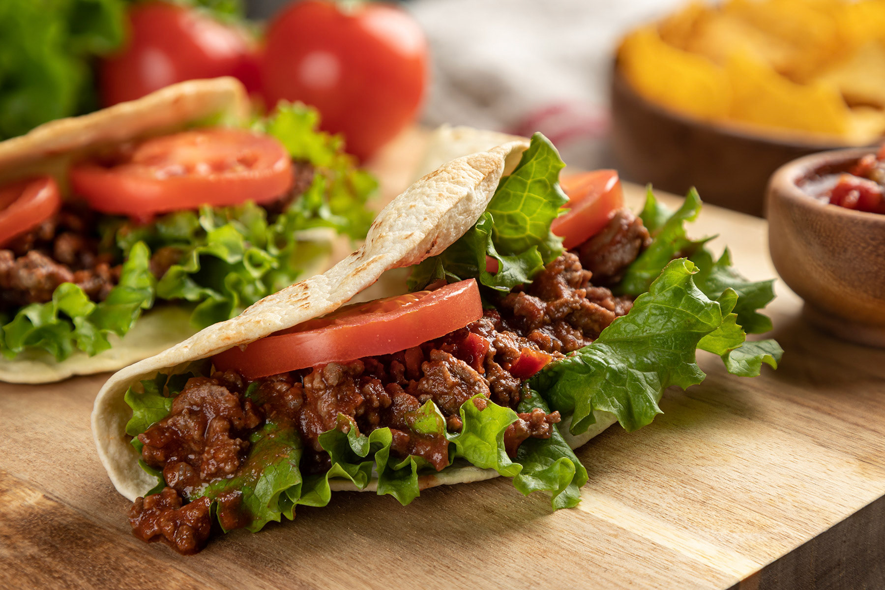 Beef taco with lettuce and tomato