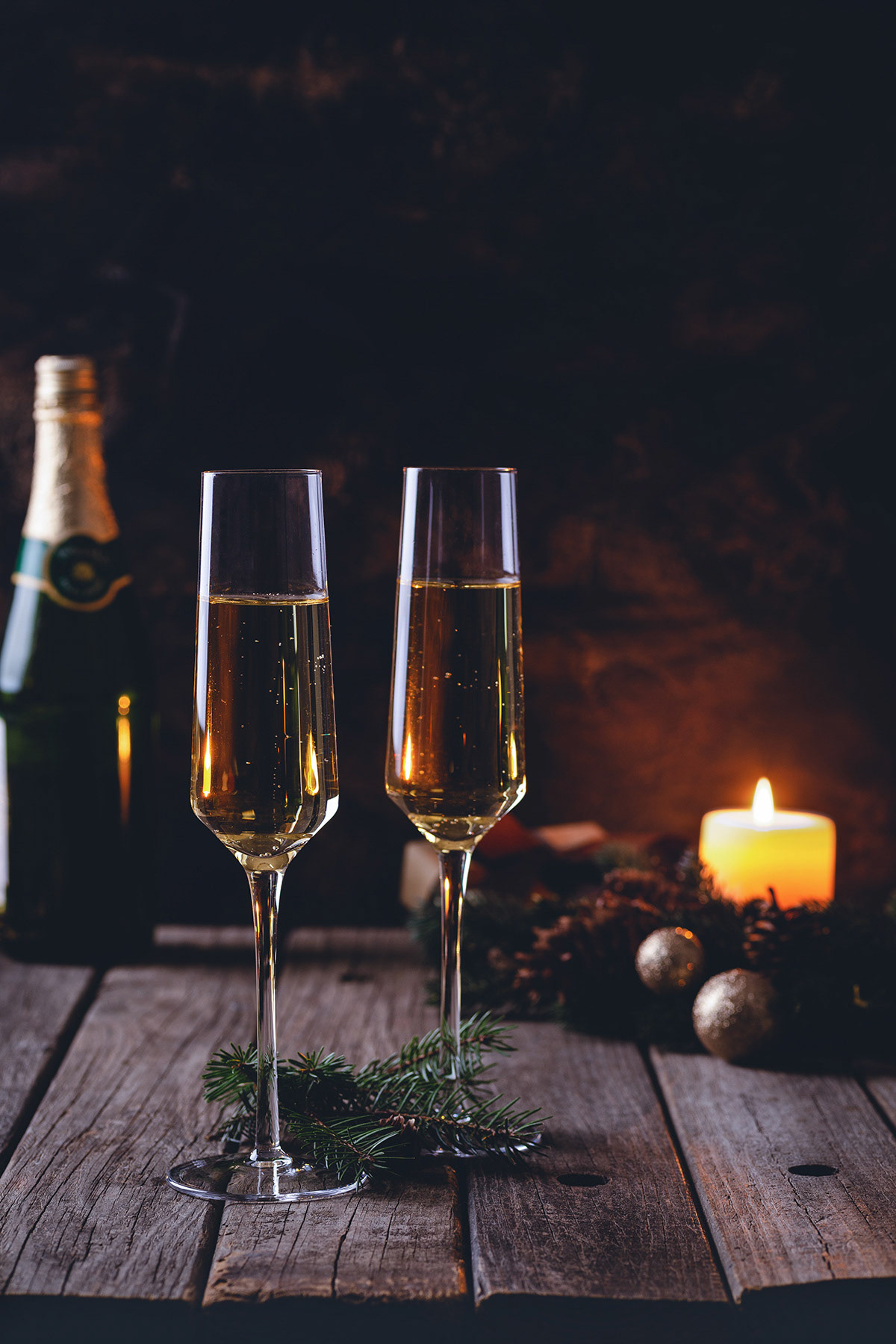 Glasses of champagne on rustic background