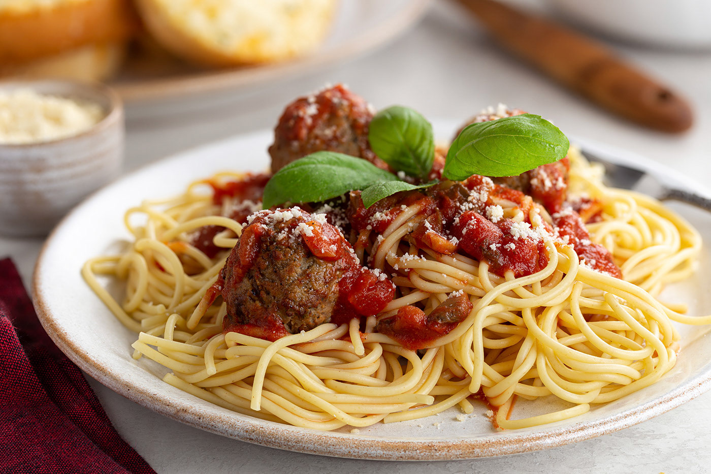 Spaghetti and meatballs garnished with basil