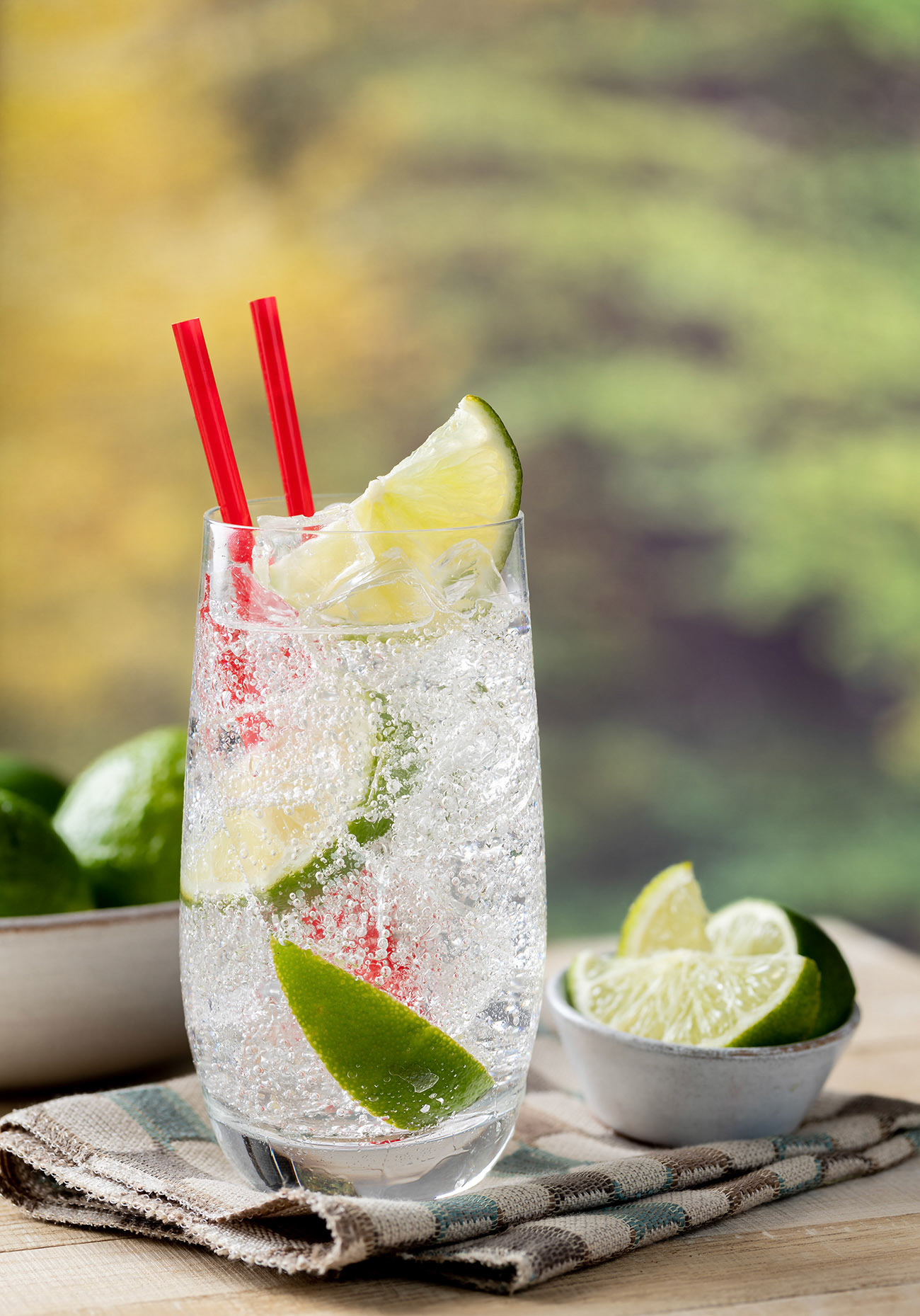 Glass of sparkling cold water with lime