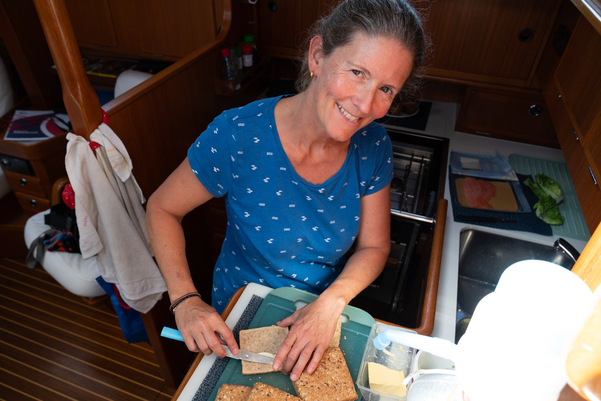 Corinne is preparing food for the crew.
