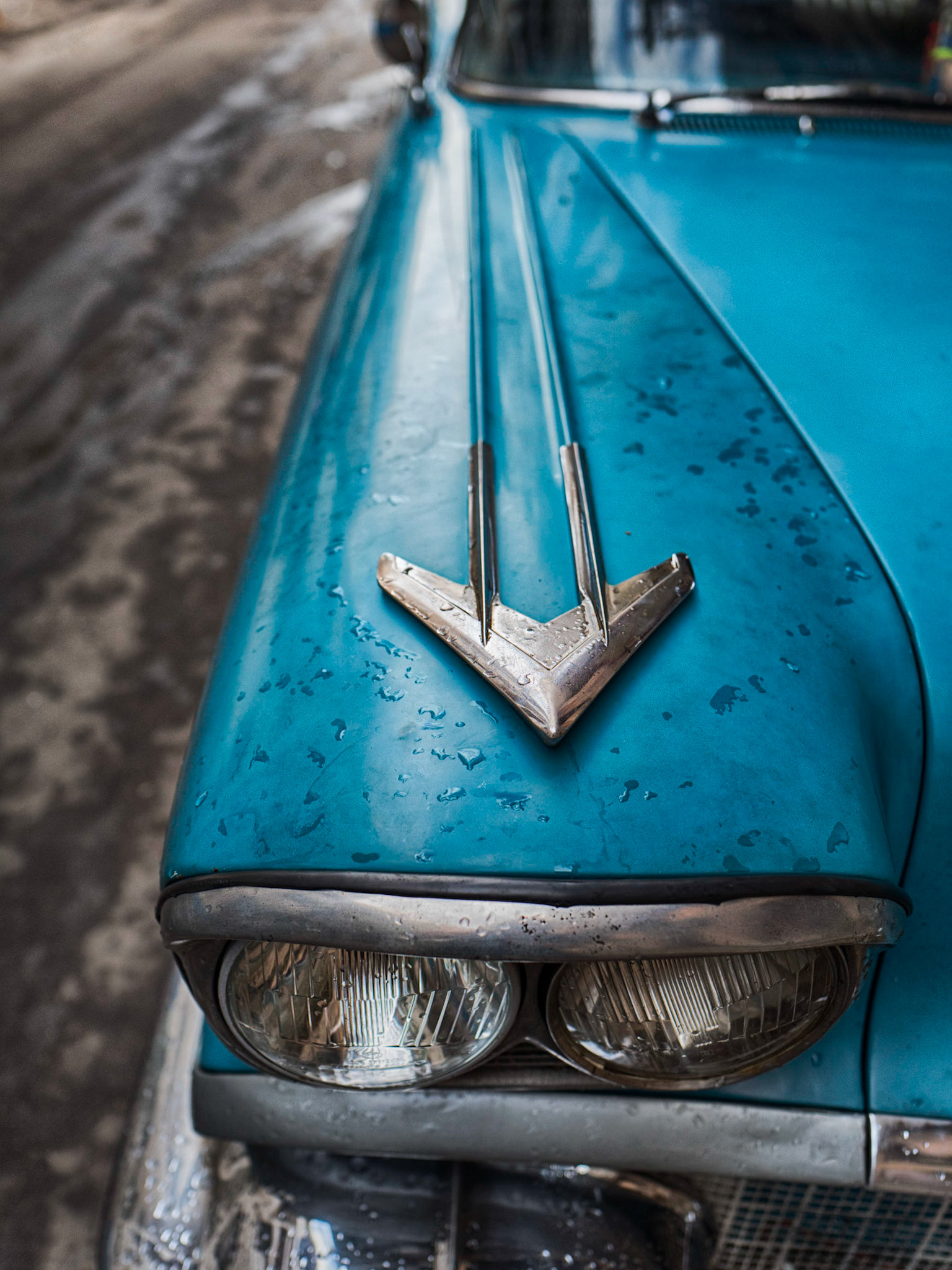 blue painted Cuban classic car with chrome arrow design. Havana, Cuba.