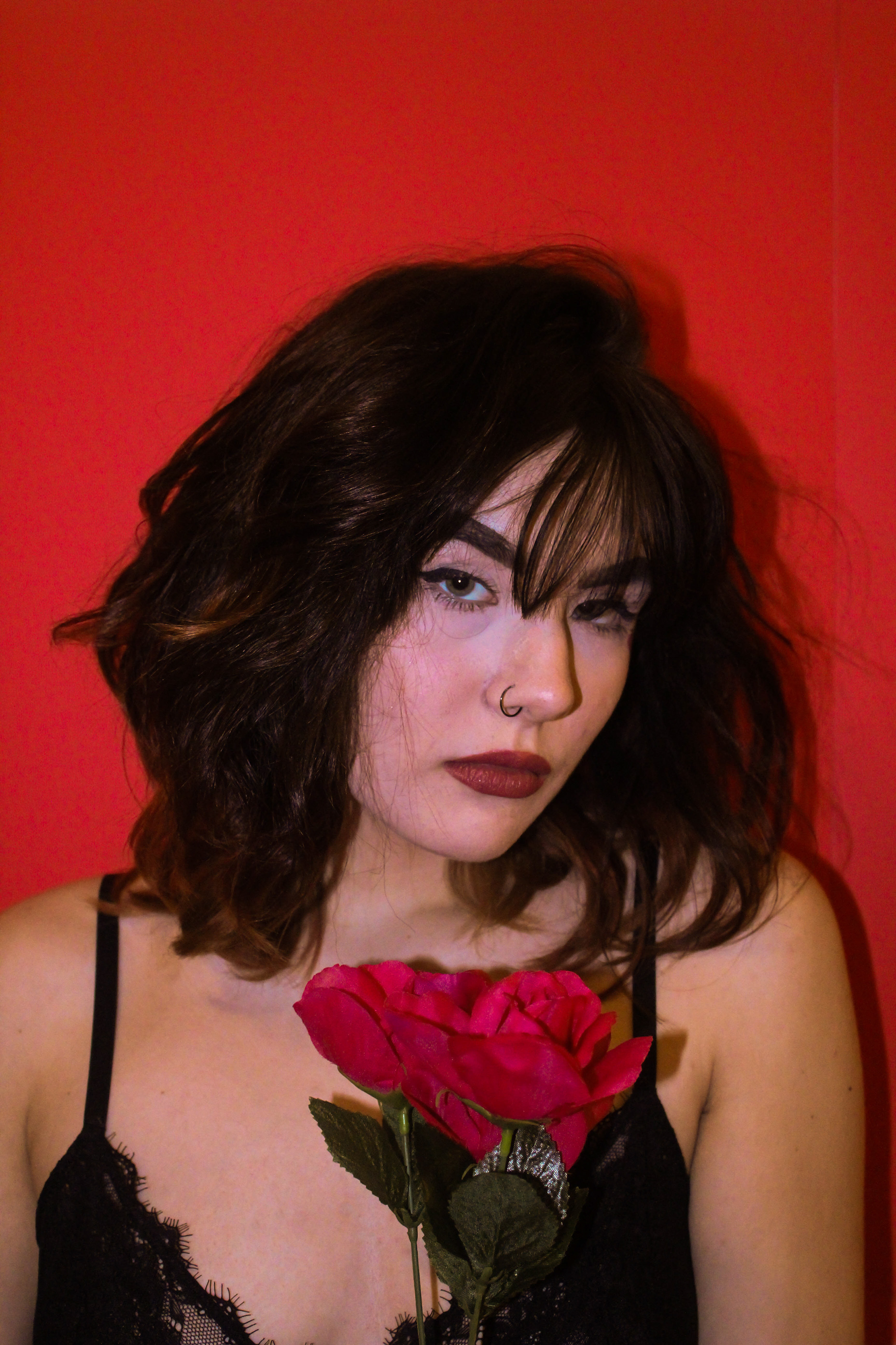 February 2020 | Portrait of Vanny against a red background with red roses