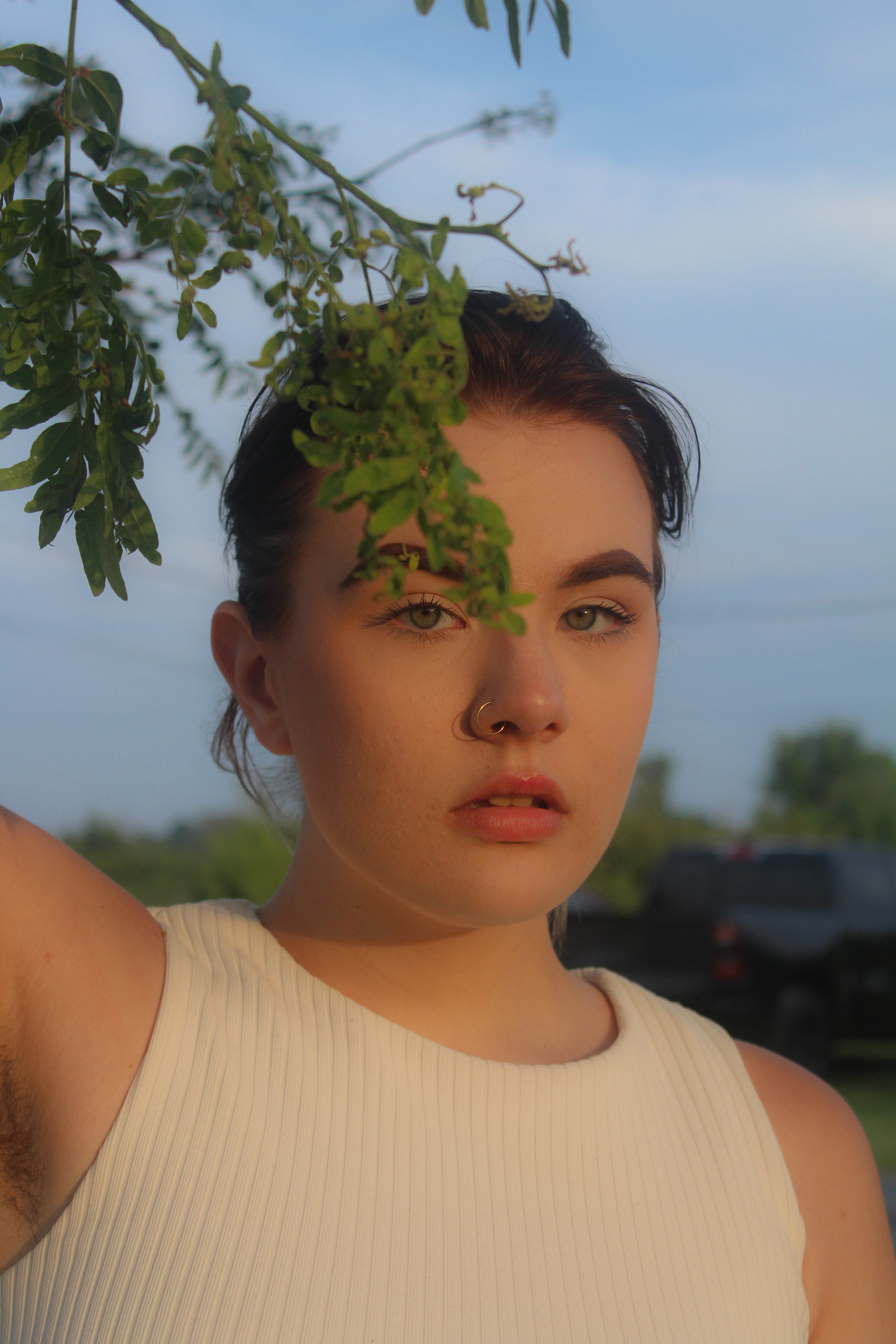 July 2019 | Portrait of Vanny posing with a branch