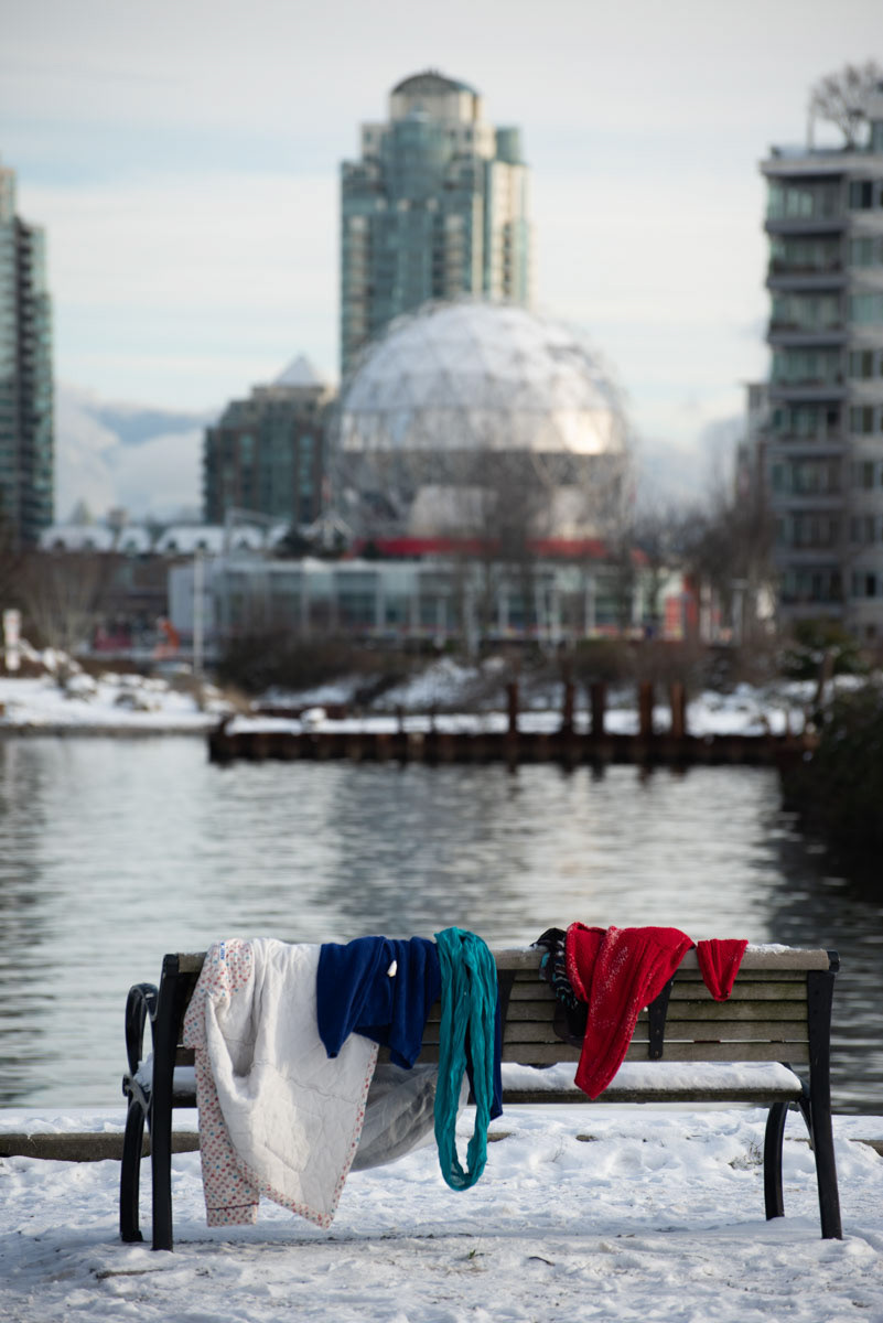 clothes left on a bench, False Creek seawall, Vancouver BC. 2022