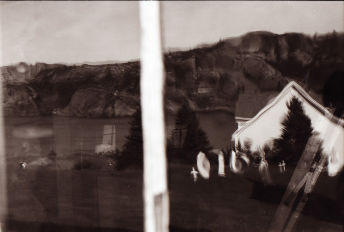 Brigus, reflection in Saint George window, 2021