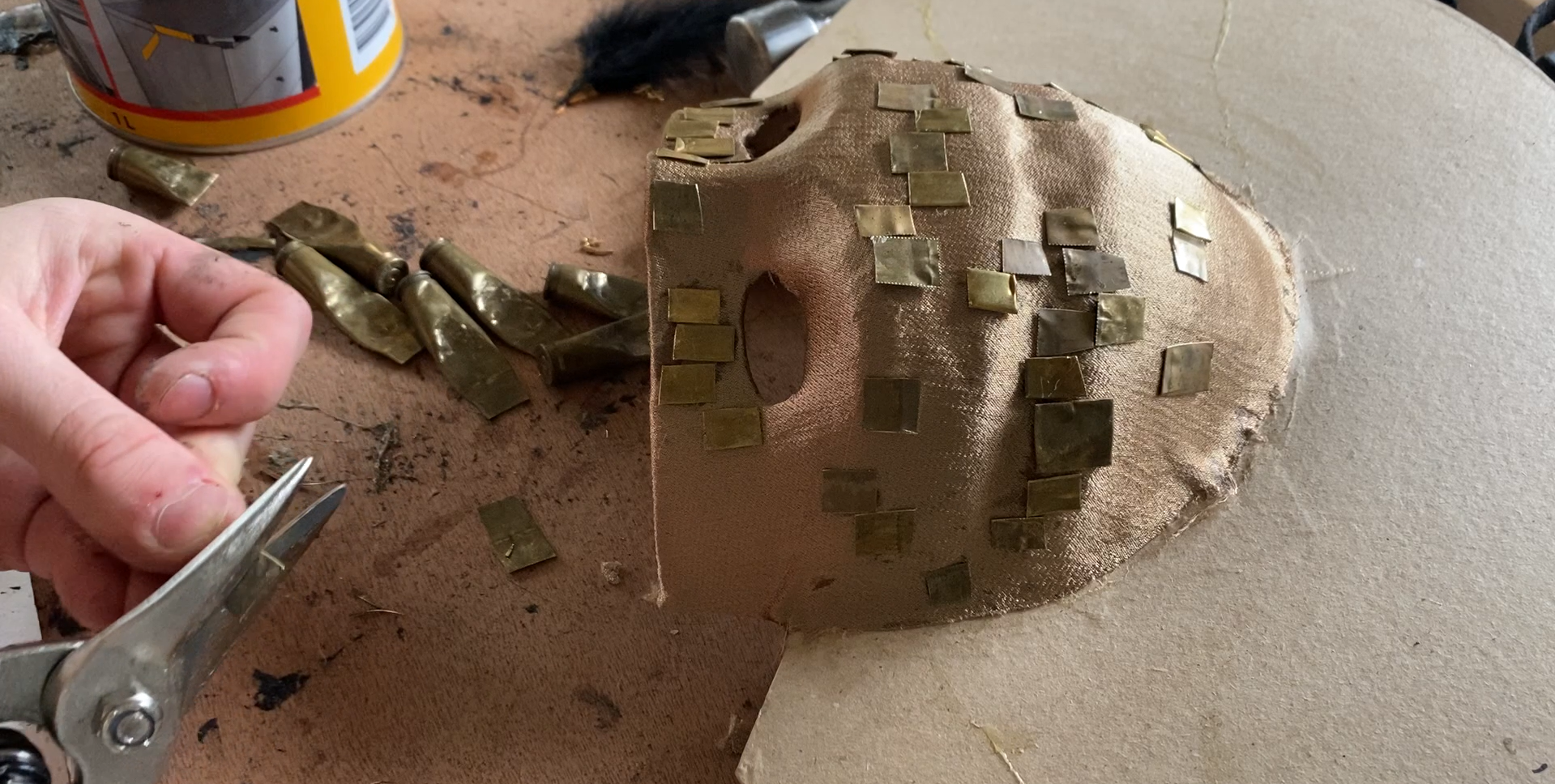 (2022). Cutting brass from old bullet casings for Nero's mask. [Photograph].