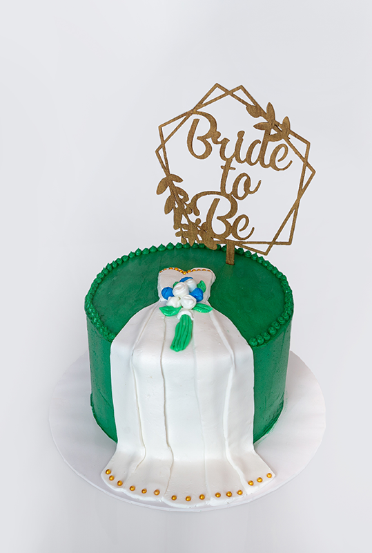 Butter cream frosted cake with the bridle made out of fondant