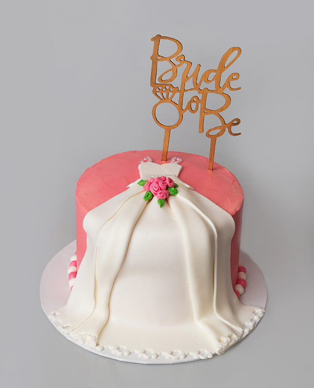 Butter cream frosted cake with the bridle made out of fondant
