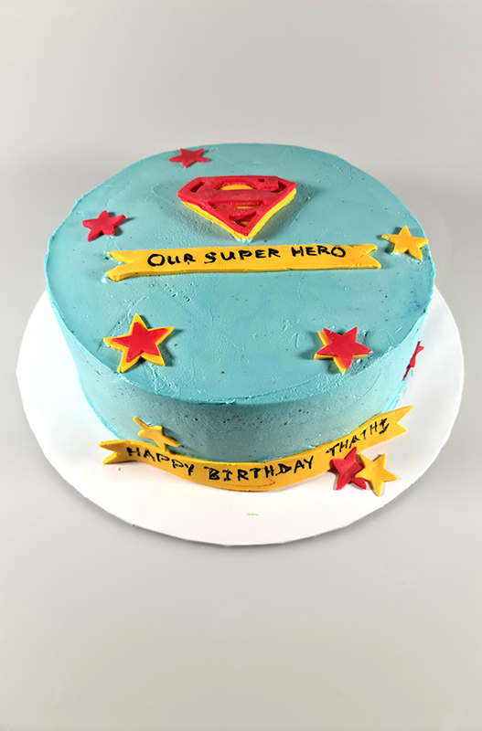 Chocolate cake covered with butter cream fronting an logo and starts made out of fondant