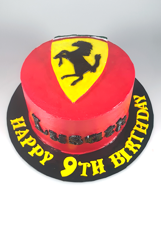Chocolate cake covered with butter cream frosting. Logo made out of fondant