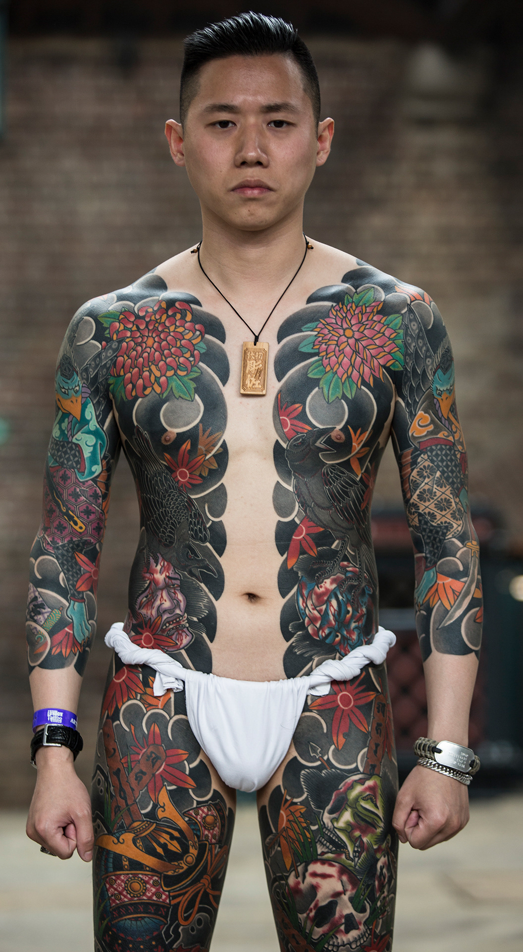 London, UK. 24th September, 2017. A man with a Japanese style body suit  tattoo, before shading and colouring has been completed, at the 13th London  International Tattoo Convention, which took place over