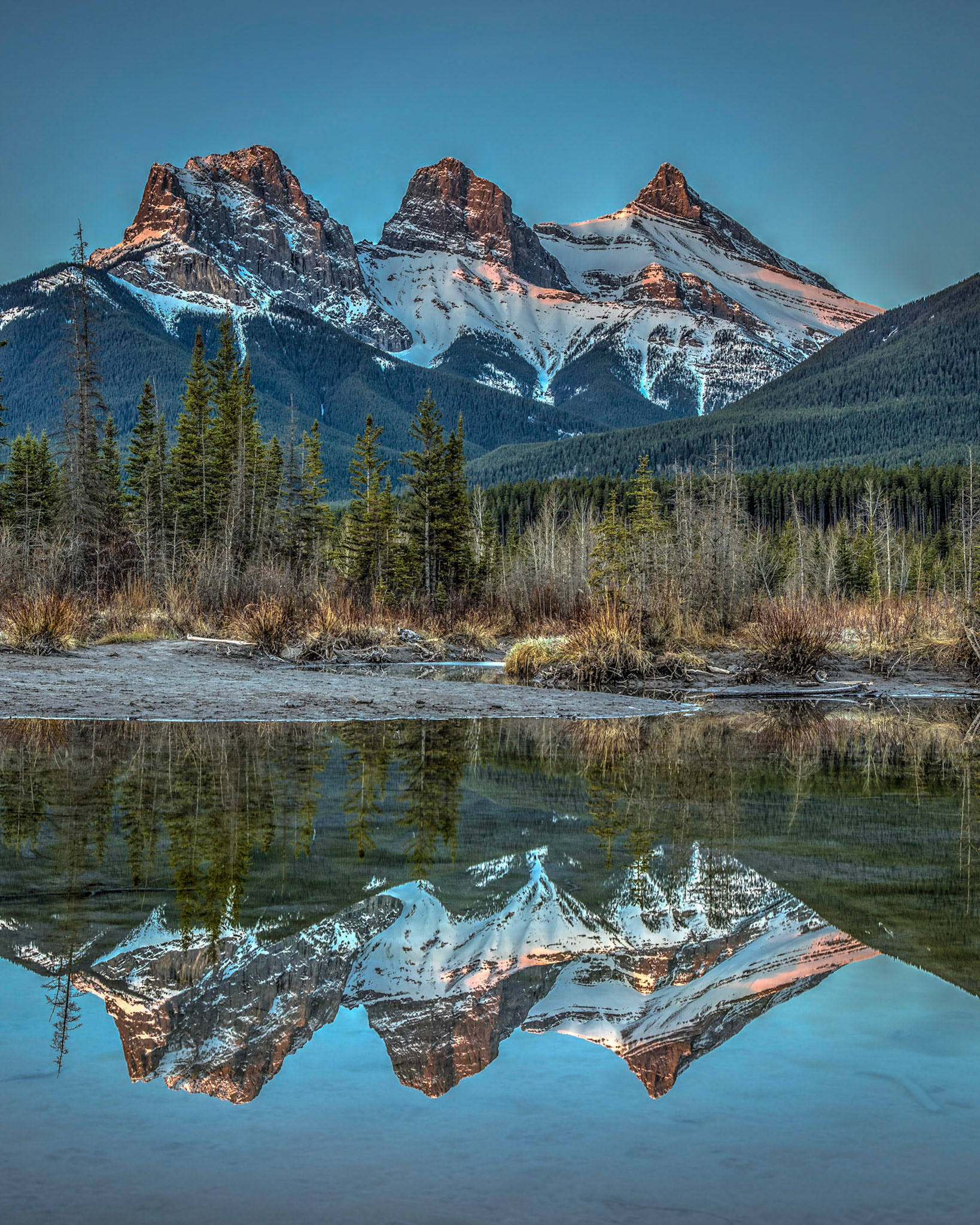 First shot of the morning alpine glow on the Three Sisters in Canmore.