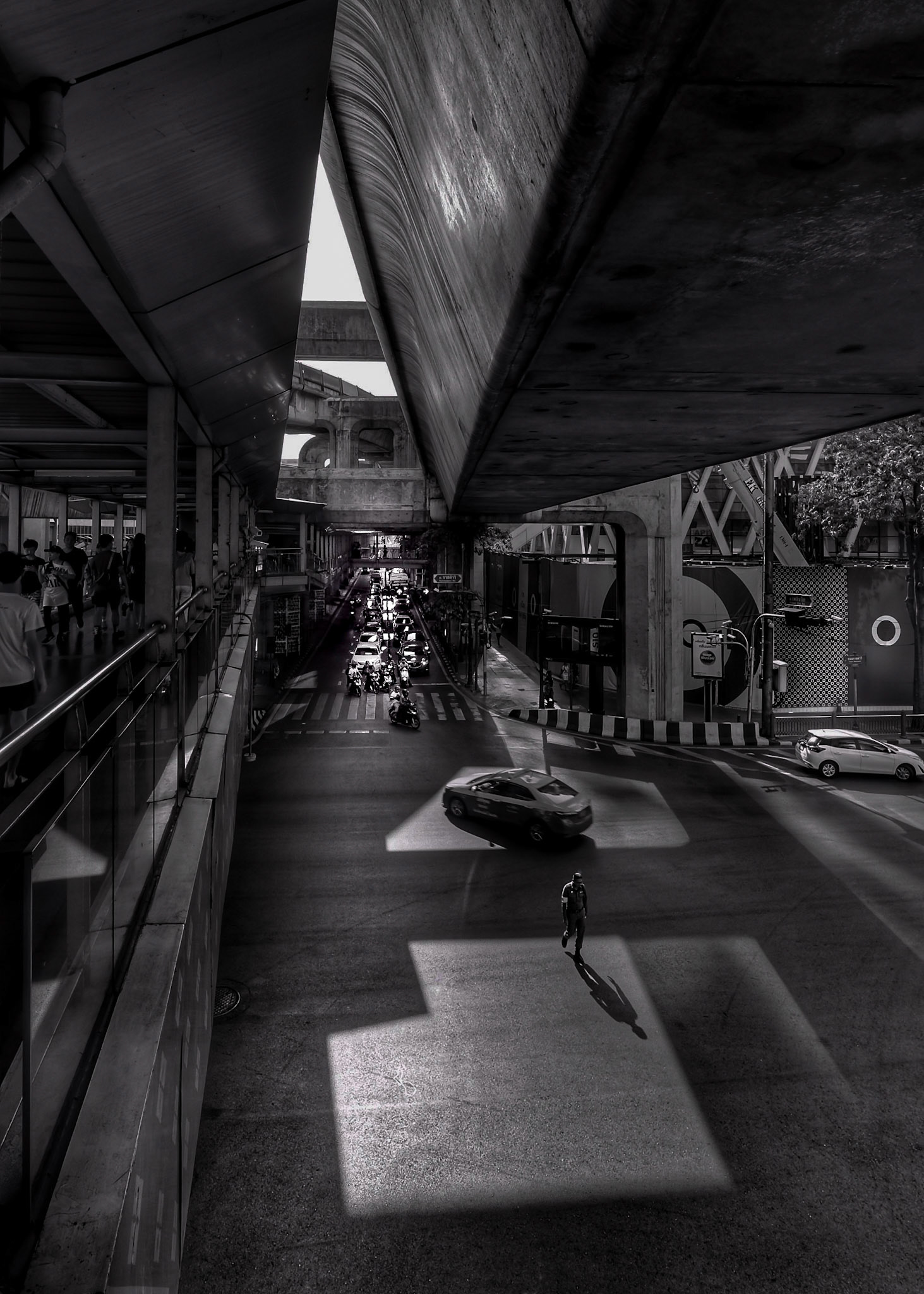 A Traffic Cop makes his way to get in position to direct the traffic in Bangkok