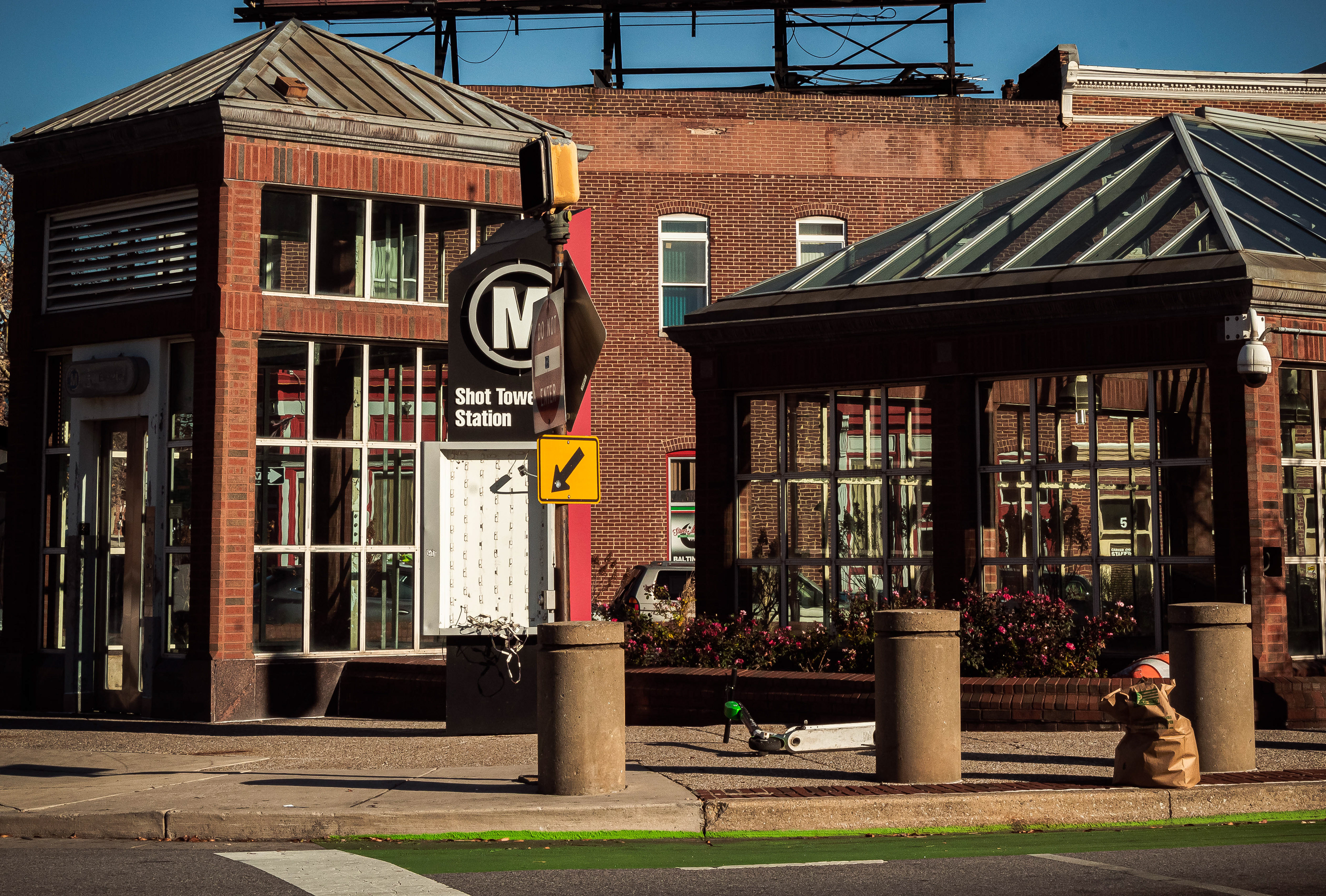 The southern entrance of Shot Tower Station located in the central area of Baltimore. Within this location is are shelters, tourist landmarks, and residential homes.