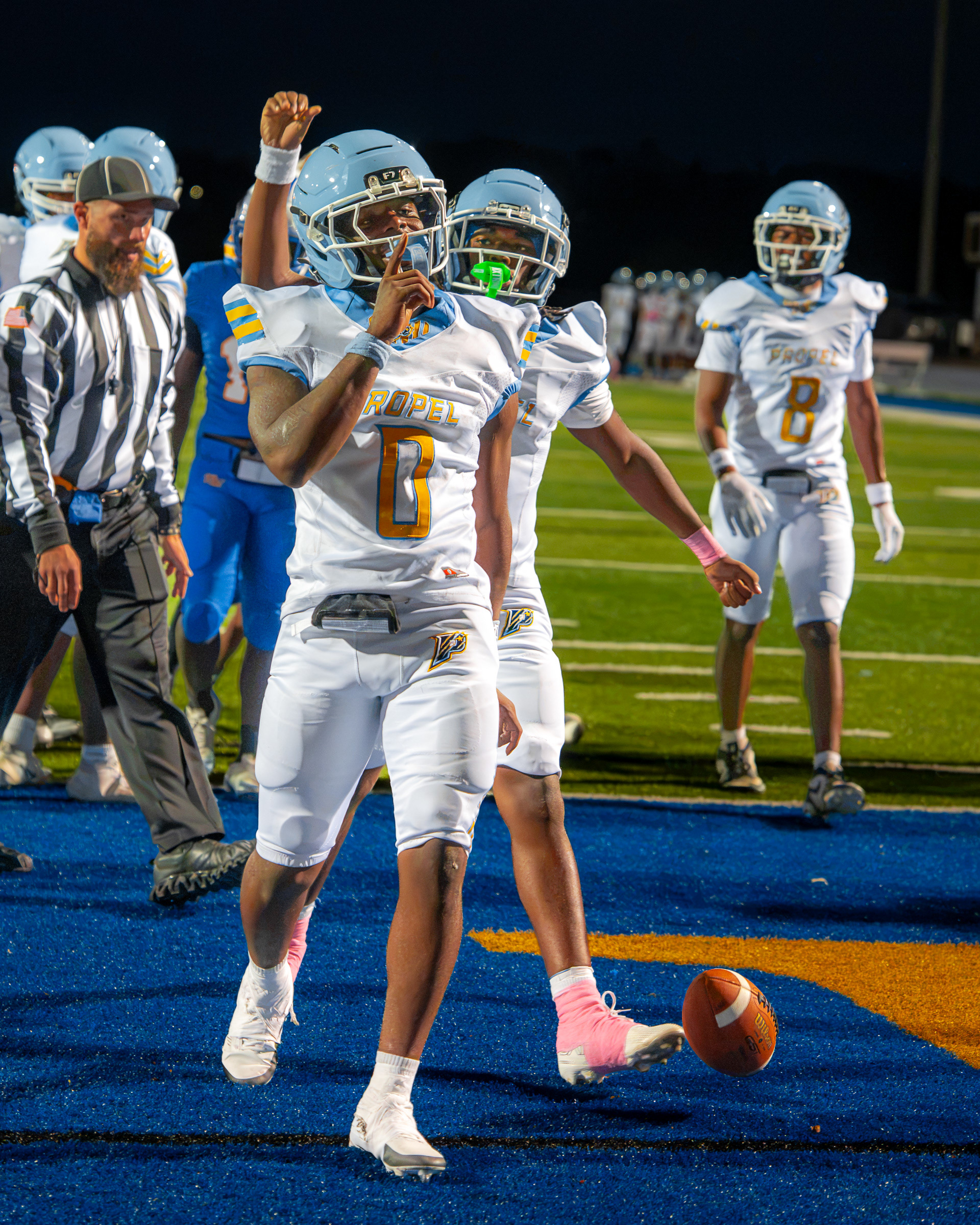 Propel Braddock hill's Senior Maurice Williams (0) is joined by his teammates to celebrate his touchdown at West Mifflin Area high school during the game on Oct. 9 2026.