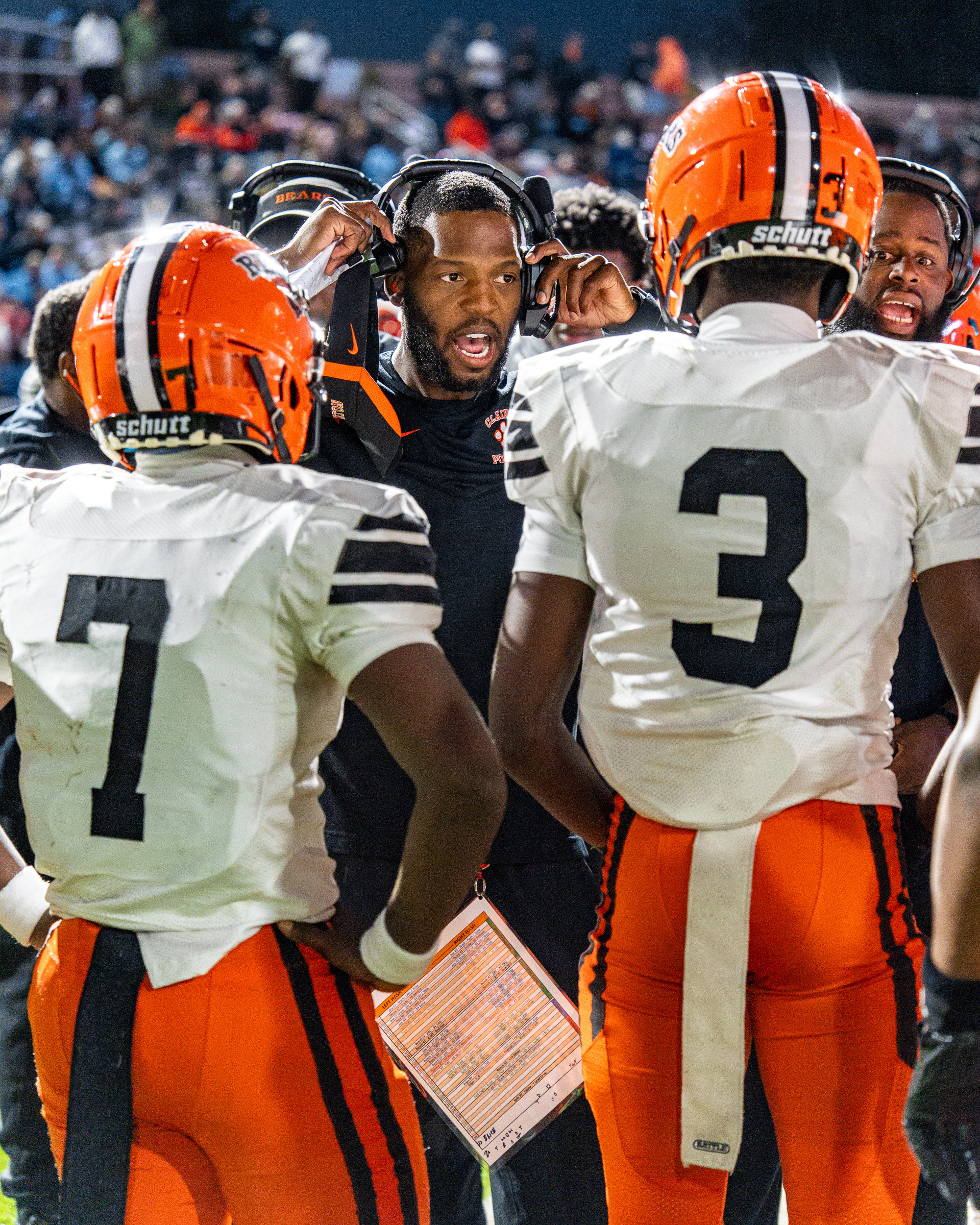 The coaches of Clairton high school talks with the players of Clairton high school at the game on Sept. 25 2026 at Washington high school stadium.