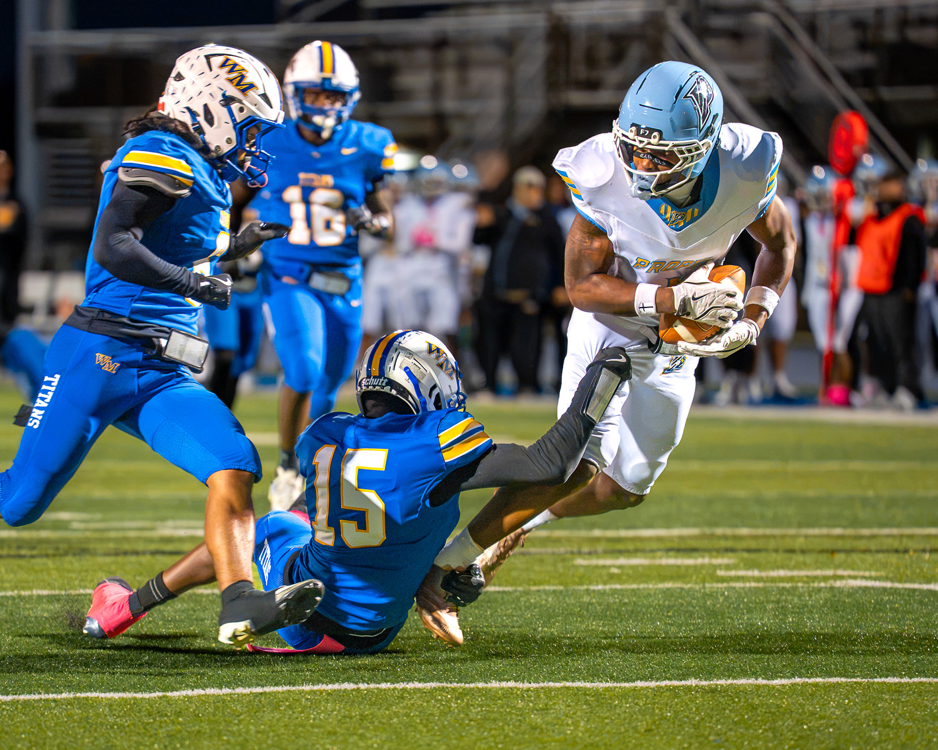 Propel Braddock Hills' Gabe Jenkins (1) carries the ball as West Mifflin's No. 15 attempts a tackle during a game Friday, Oct. 9, 2026, at West Mifflin Area High School.