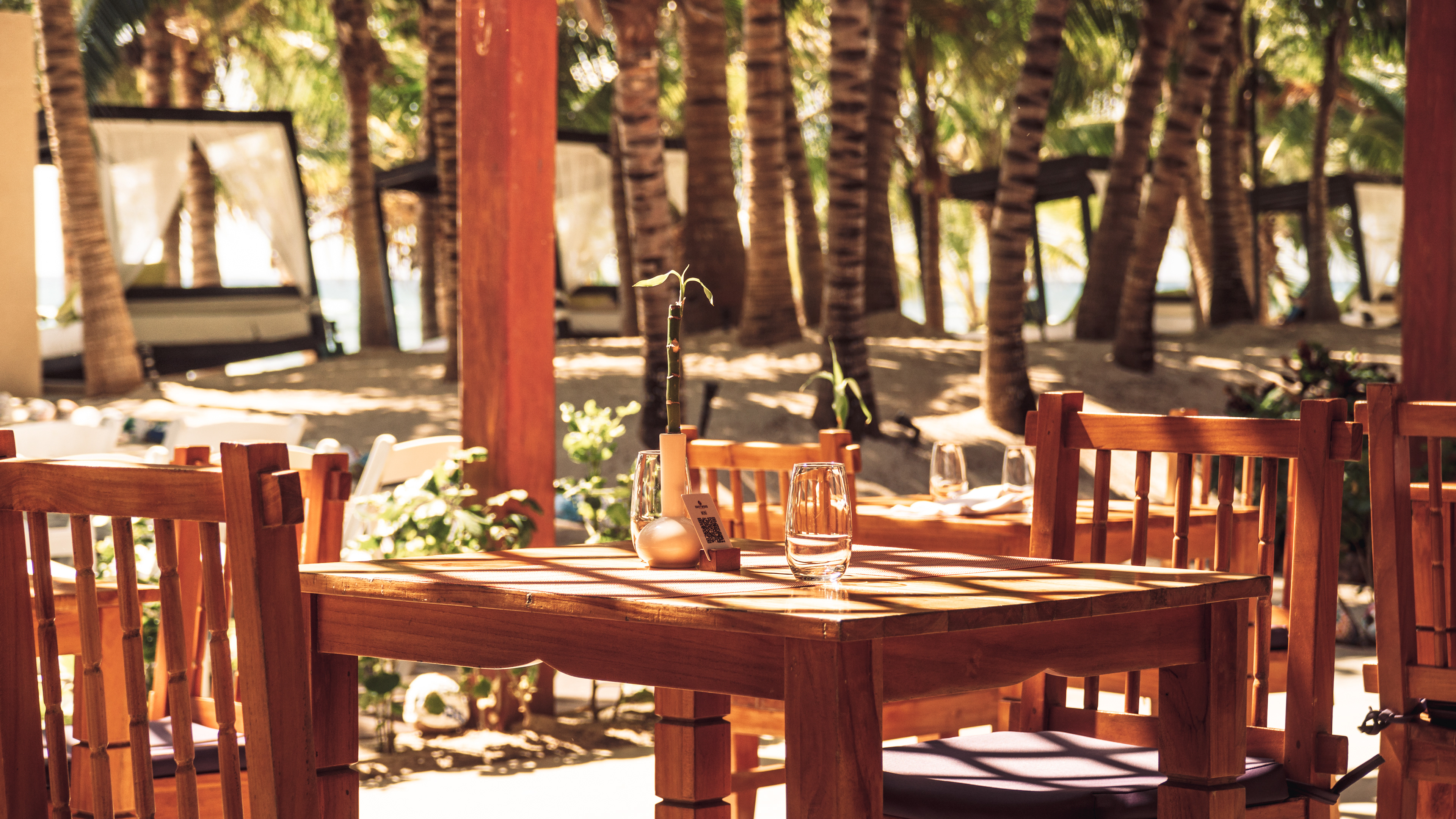 A mahogany dining set at a resort in Mexico, shot under natural light.