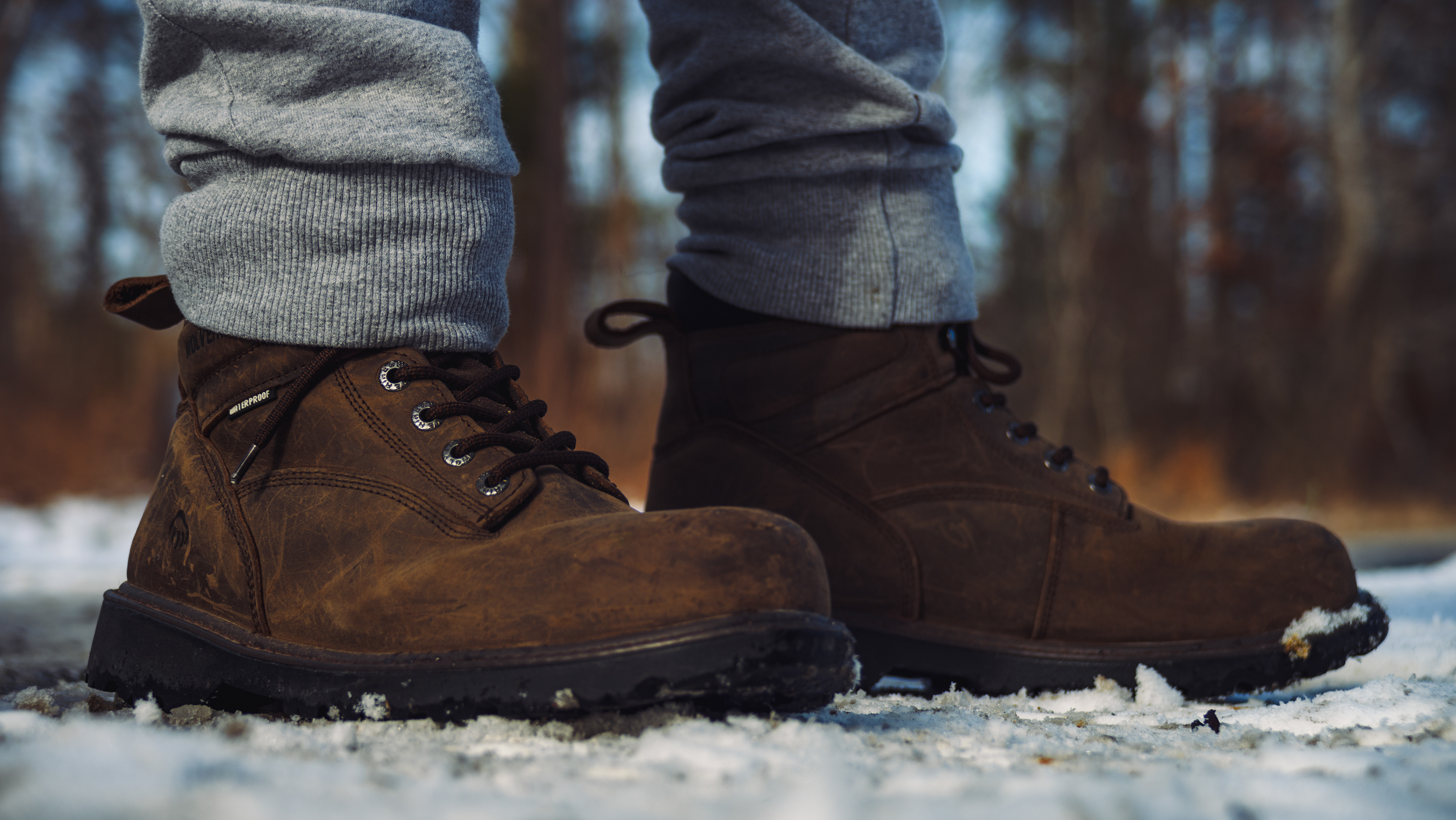 A pair of boots in the snow, to convey warmth and waterproofing.