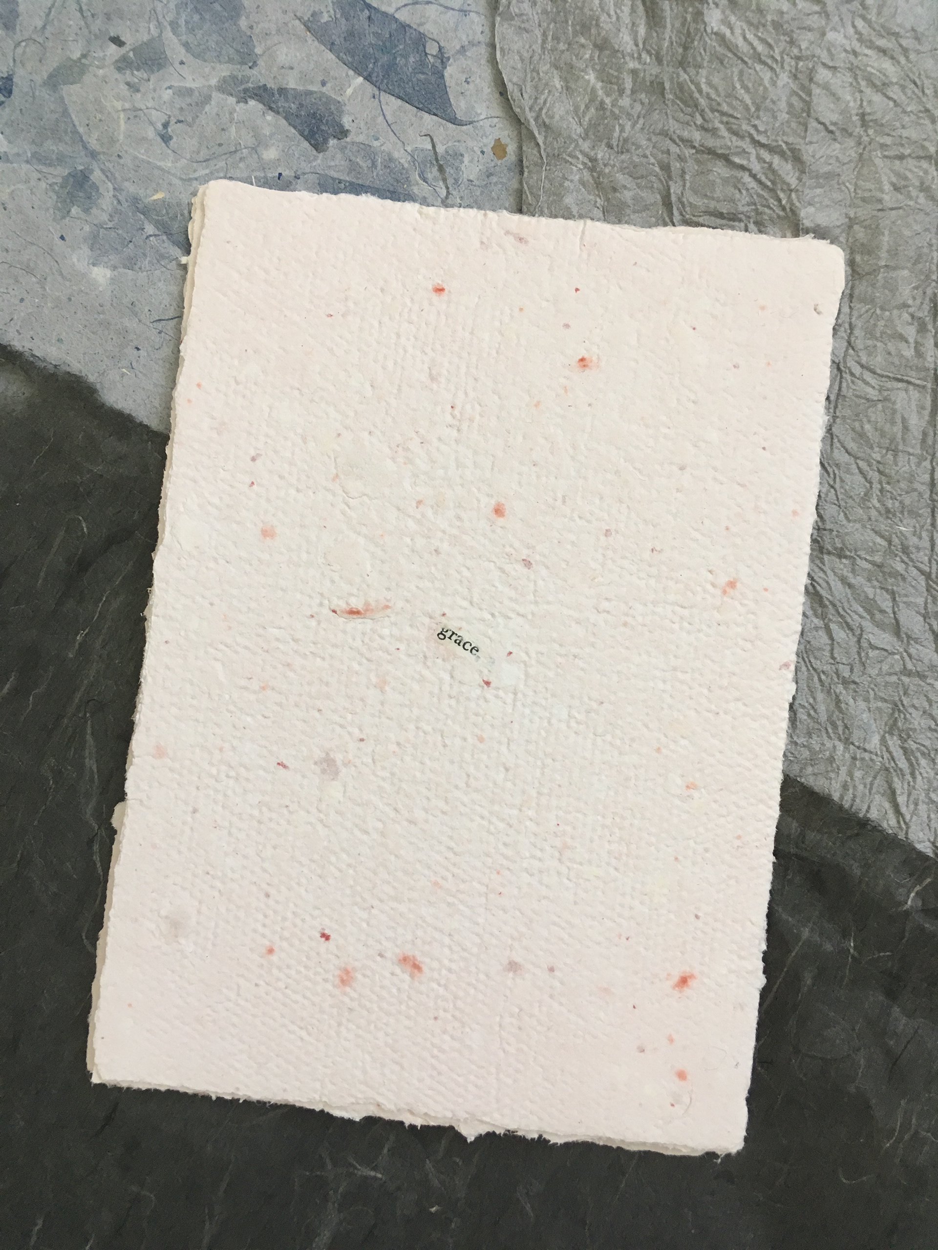 Handmade paper featuring collaged text