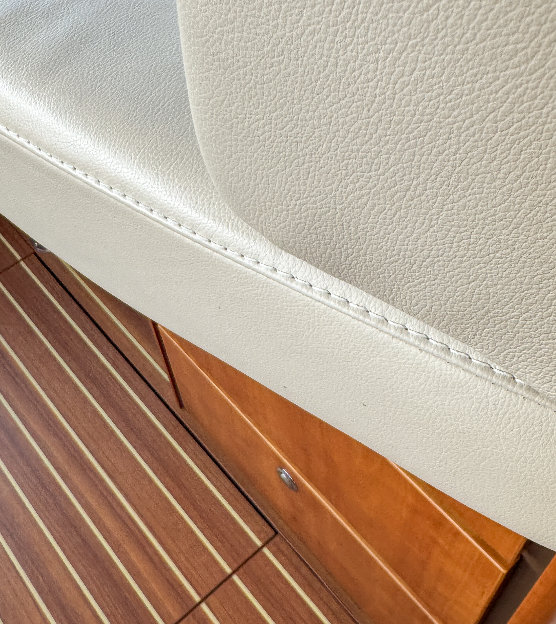 Admire the perfect stitching on the real leather seating