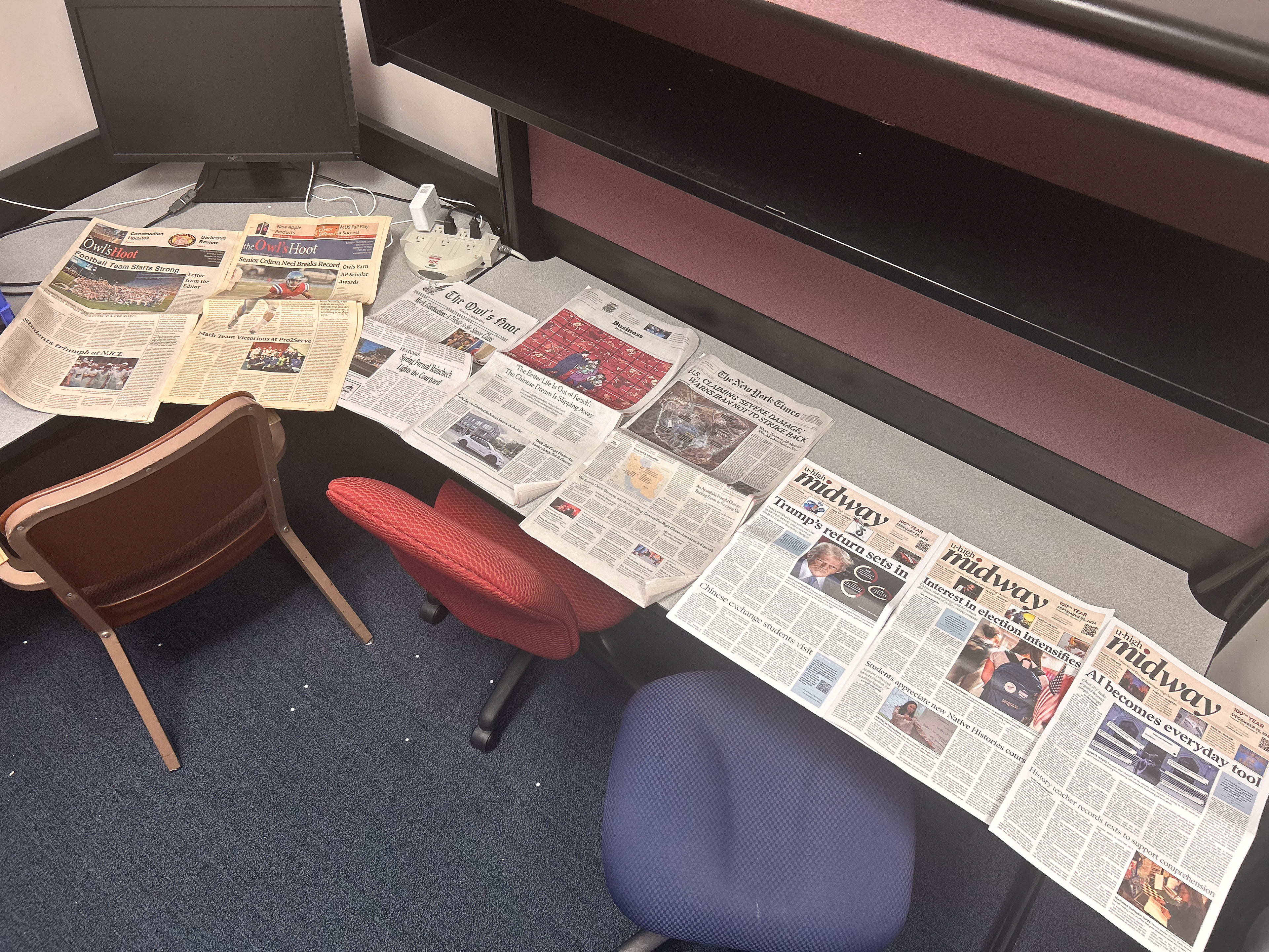 A collection of papers from Columbia and my school's archives on a table in our previous newsroom. We promptly had to move to a much smaller space, but continued our mission of developing a new paper.