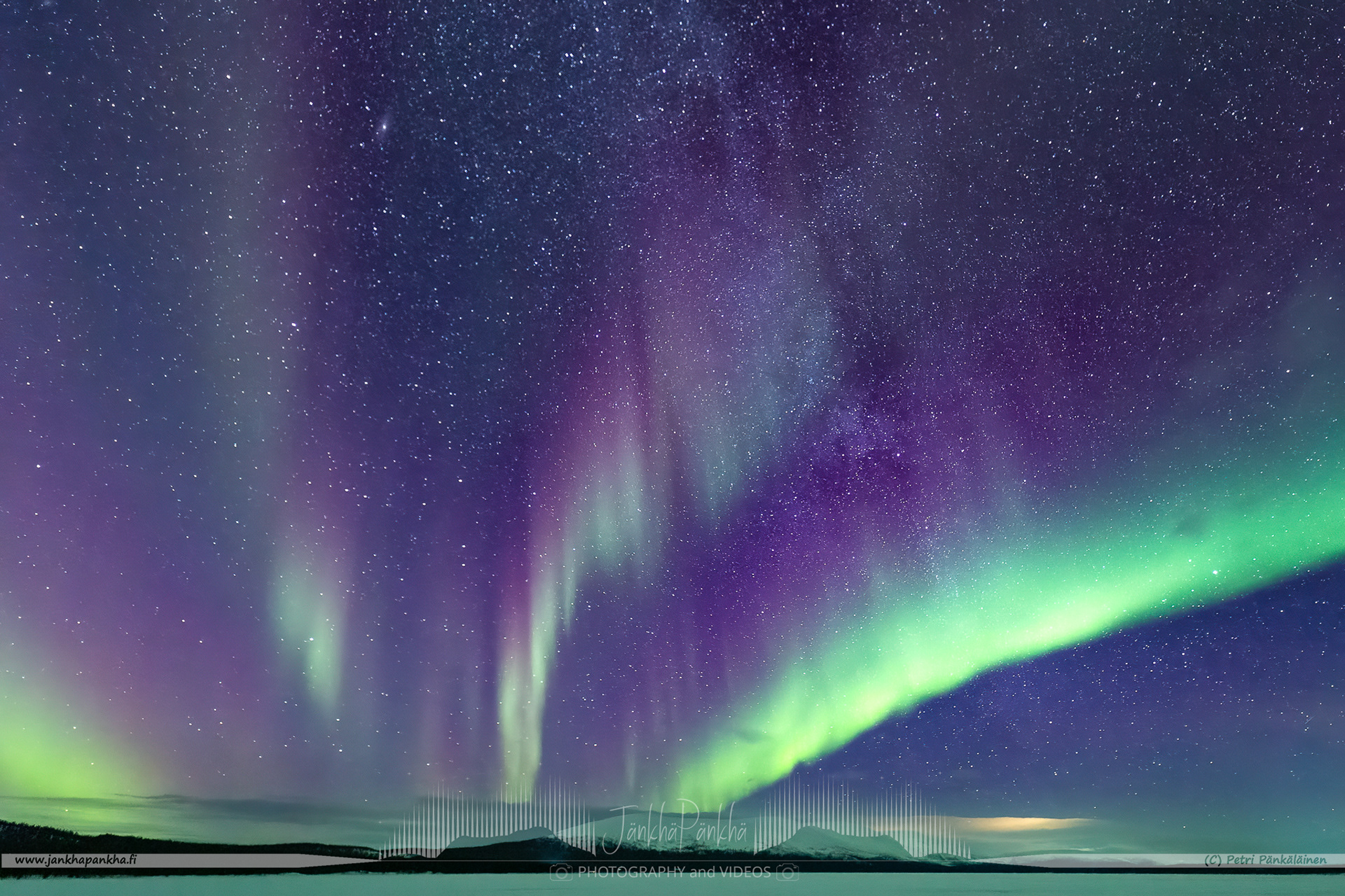 Magenta northern lights over the lake Pallasjärvi in Finland. The photo is from the Punainenhiekka hut. The  Punainenhiekka Day-use Hut is situated at the south end of Lake Pallasjärvi.