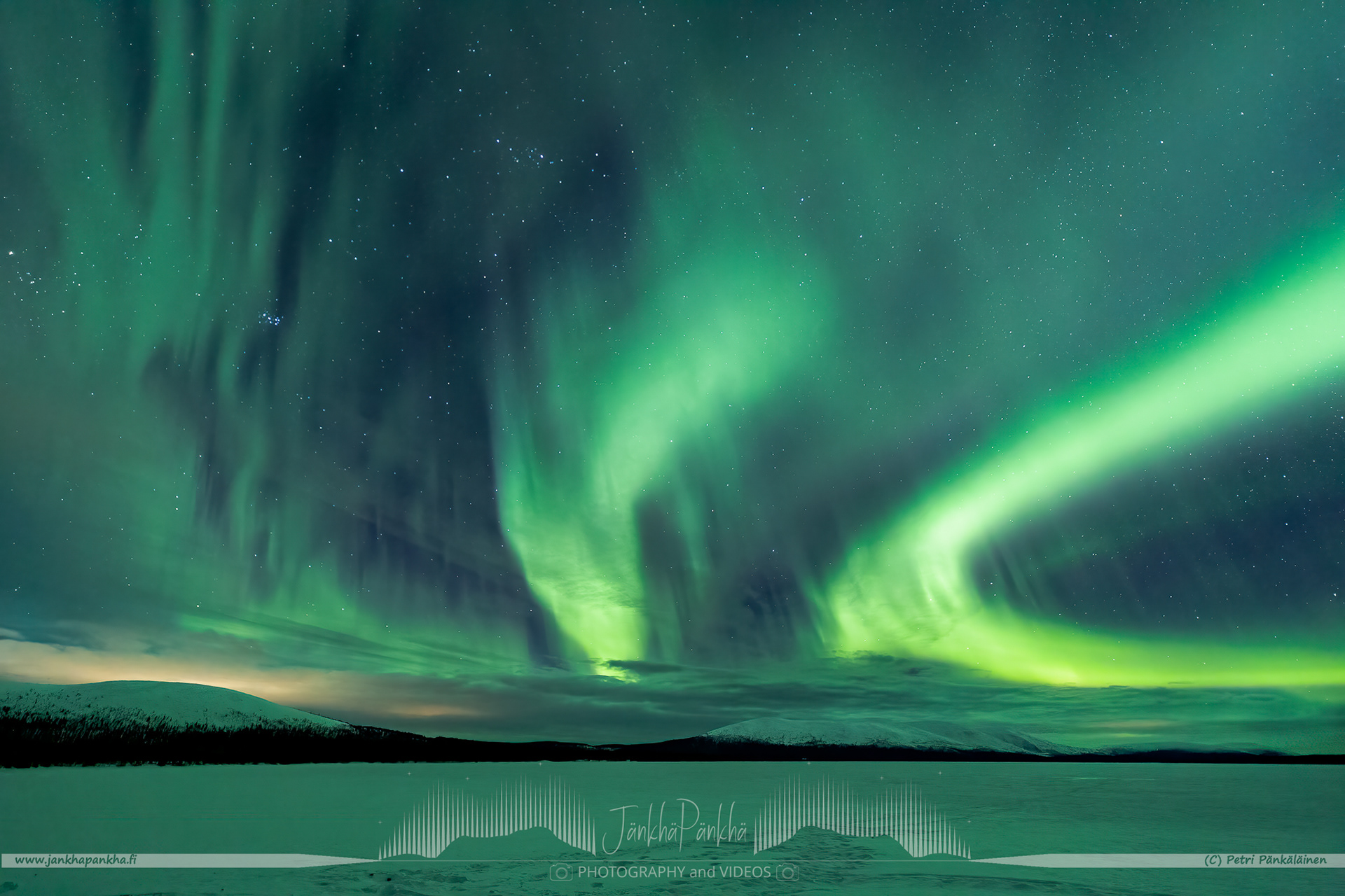 Clouds with the northern lights over the lake Pallasjärvi in Finland. The photo is from the Punainenhiekka hut. The  Punainenhiekka Day-use Hut is situated at the south end of Lake Pallasjärvi.