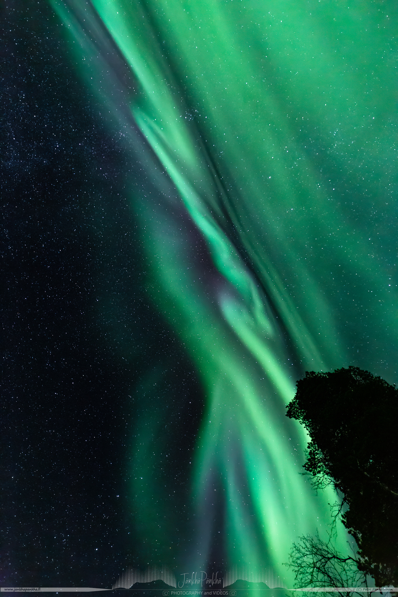 Full sky northern lights corona over the lake Pallasjärvi in Finland. The photo is from the Punainenhiekka hut. The  Punainenhiekka Day-use Hut is situated at the south end of Lake Pallasjärvi.