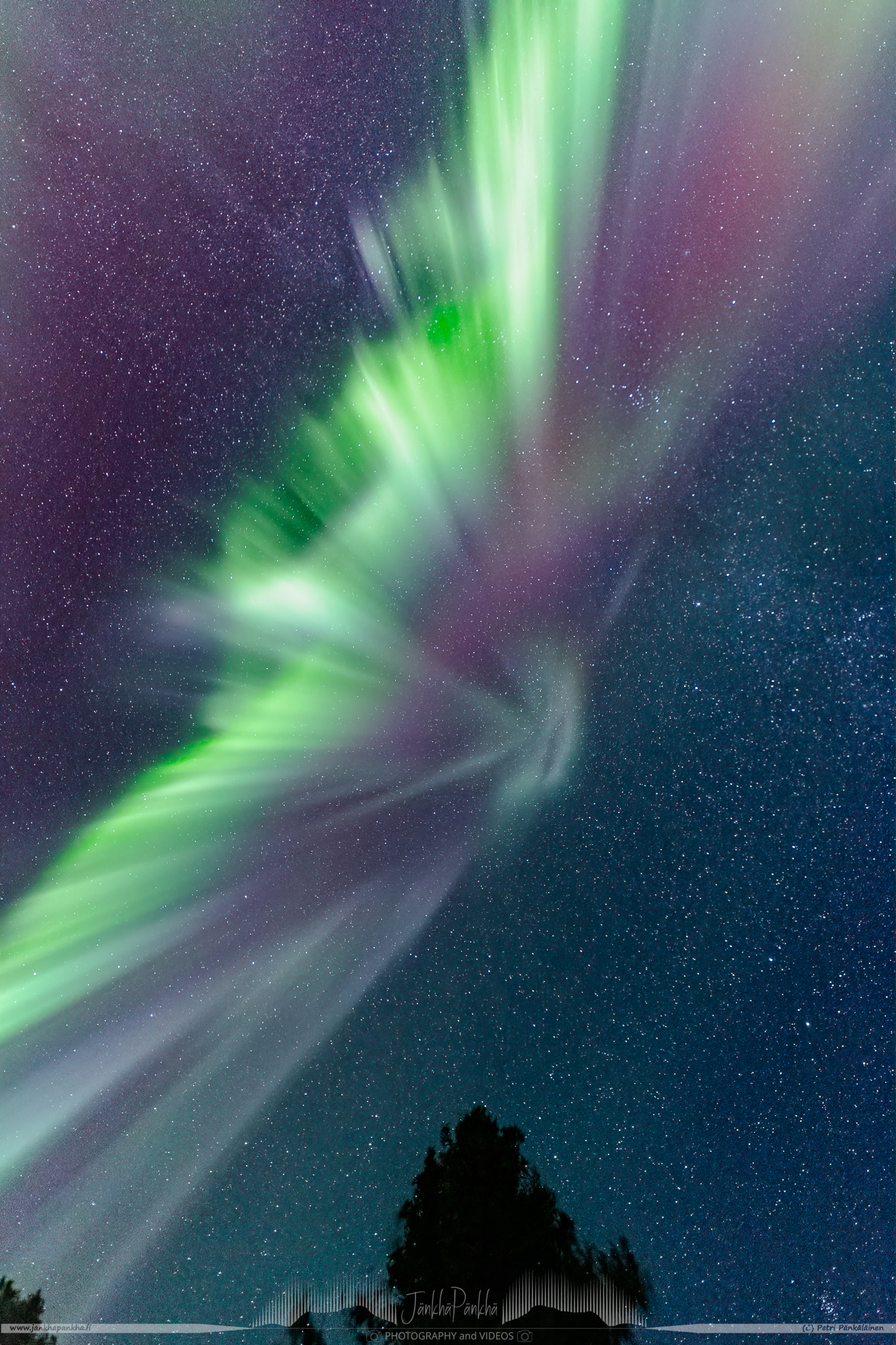 Full sky northern lights corona over the lake Pallasjärvi in Finland. The photo is from the Punainenhiekka hut. The  Punainenhiekka Day-use Hut is situated at the south end of Lake Pallasjärvi.