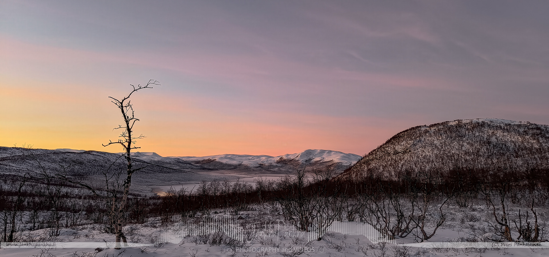 Pastel-colored skies and snow-covered landscapes during a polar night in Muotkatakka, which is the highest point on Finland's road network, at 565 meters (1,854 ft) above sea level. the highest