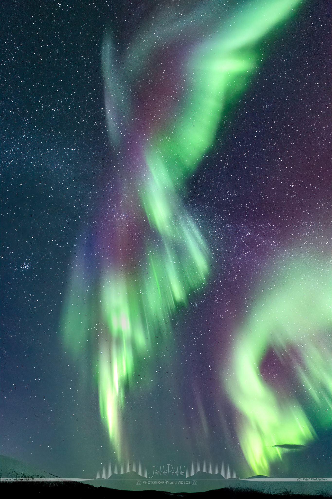 Full sky northern lights corona over the lake Pallasjärvi in Finland. The photo is from the Punainenhiekka hut. The  Punainenhiekka Day-use Hut is situated at the south end of Lake Pallasjärvi.