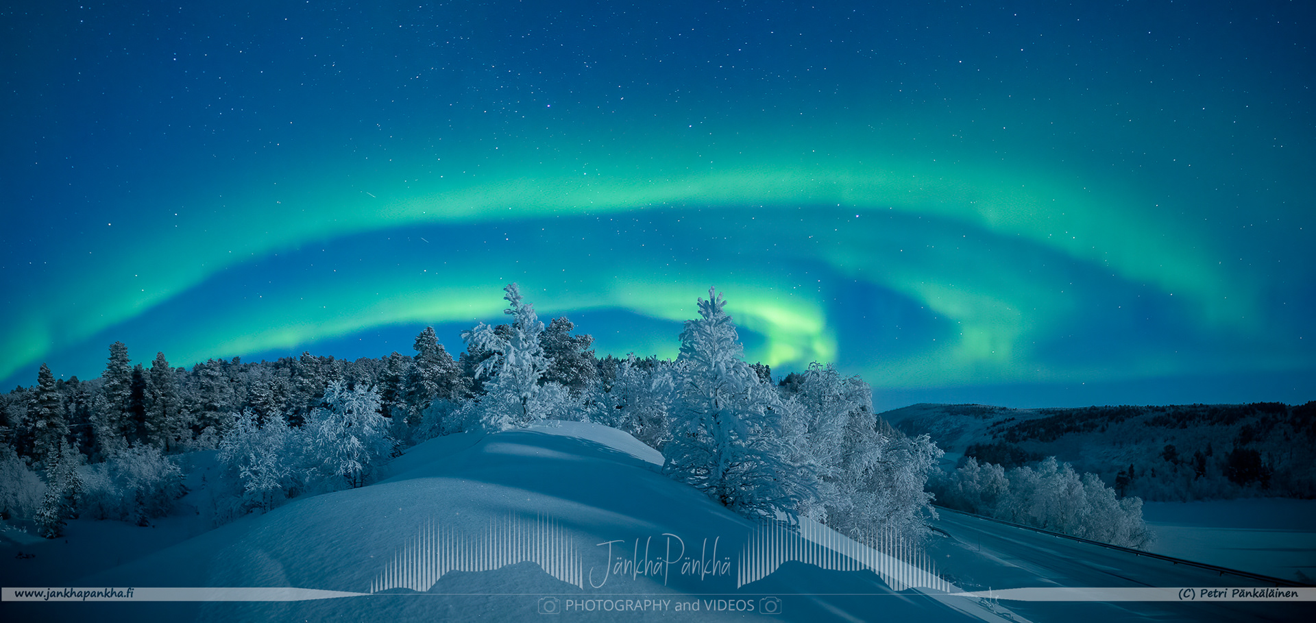 Panorama photo of the northern lights over the E4 / E75 road towards Utsjoki in Finland