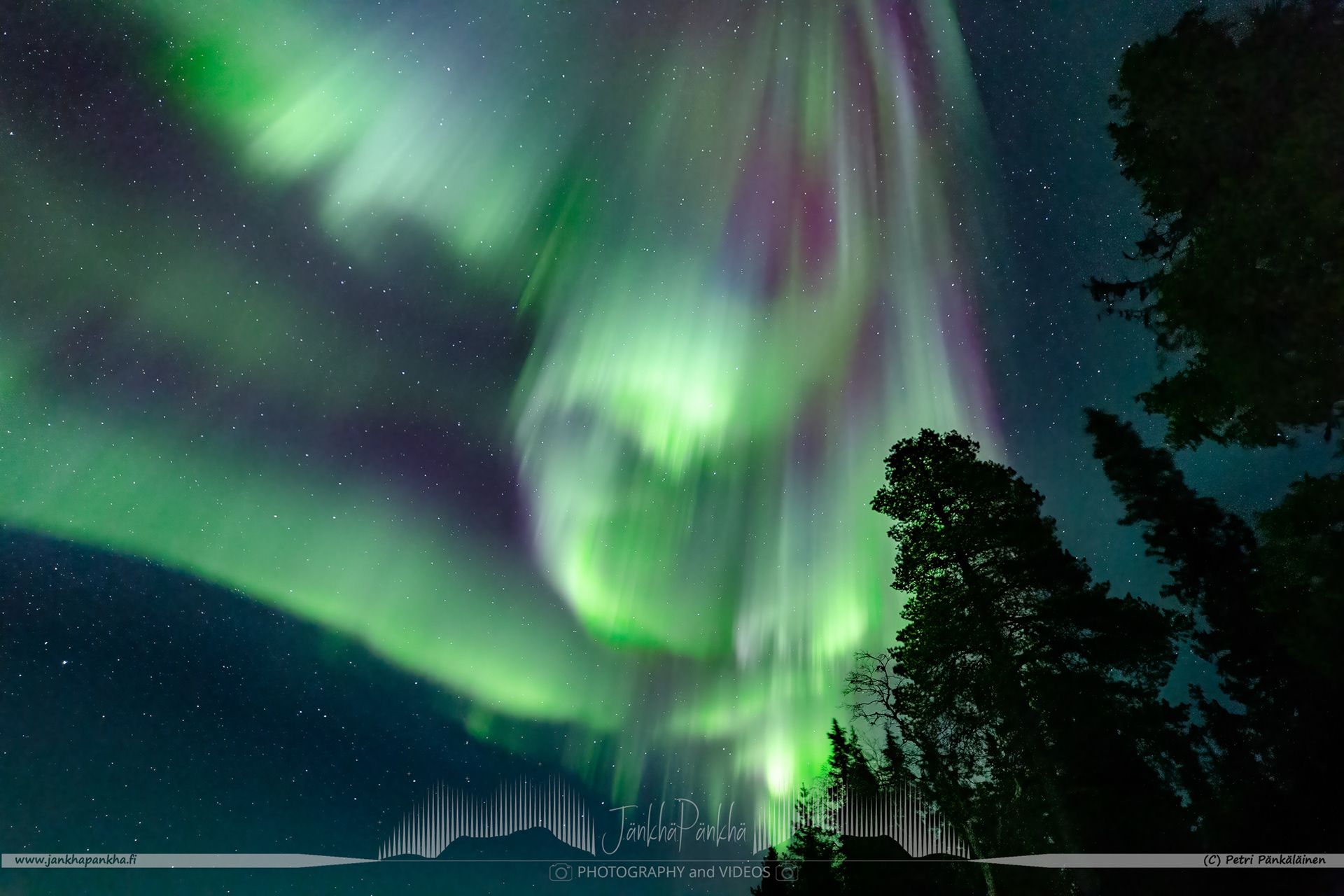 Full sky northern lights corona over the lake Pallasjärvi in Finland. The photo is from the Punainenhiekka hut. The  Punainenhiekka Day-use Hut is situated at the south end of Lake Pallasjärvi.