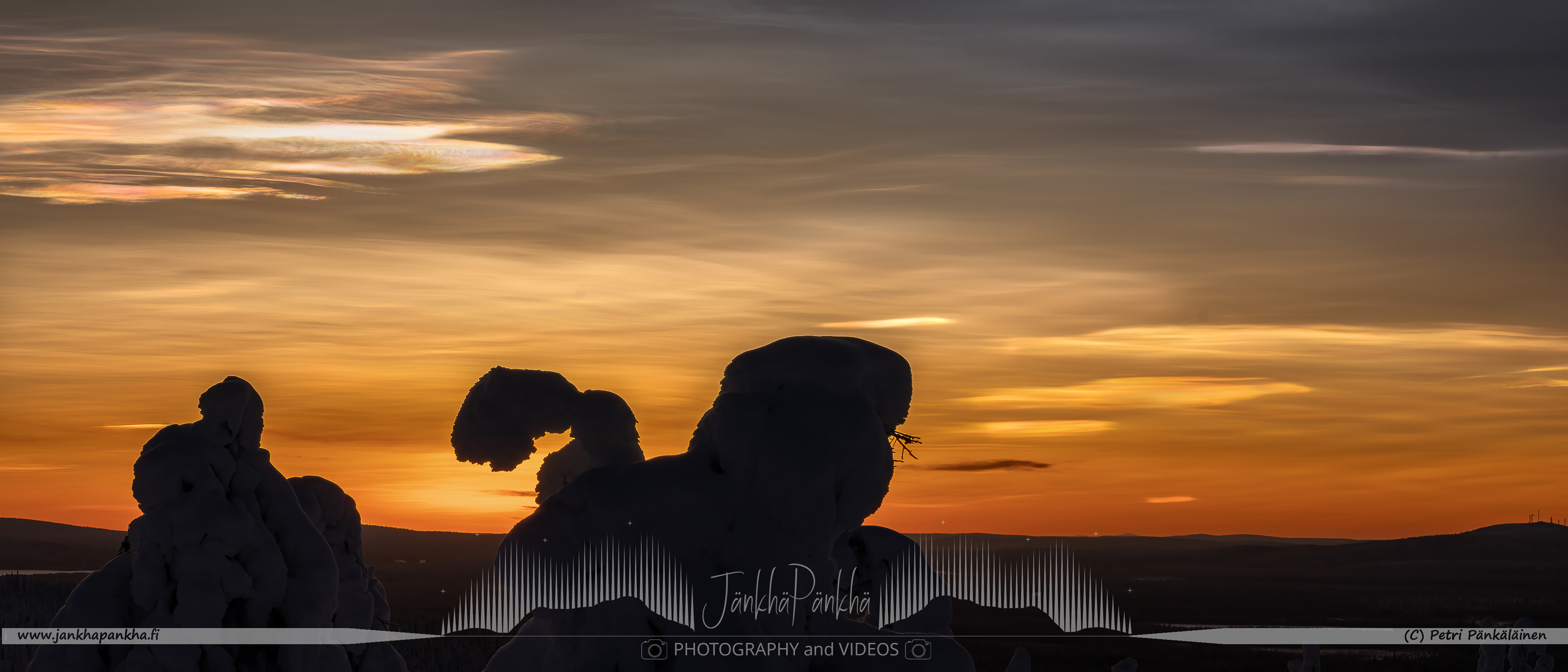 Pastel-colored skies and snow-covered landscapes during a polar night in Pallas-Yllästunturi National Park, Finland. The stratospheric clouds starts to form in the sky.