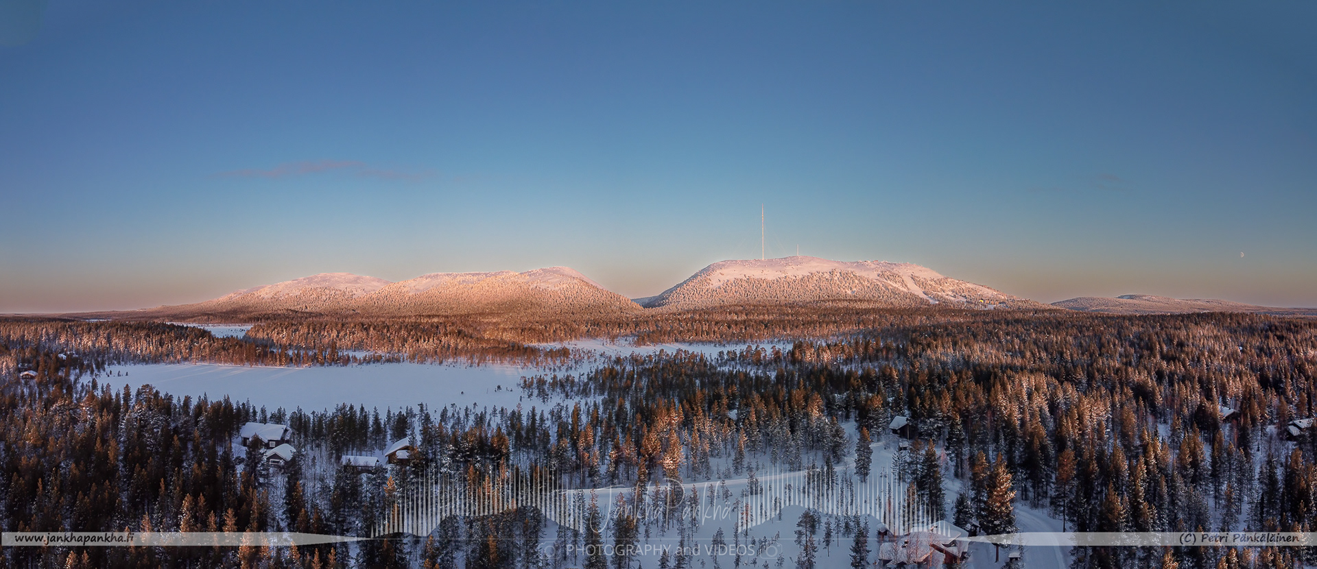 Early winter sunrise with the chain of fells of Pyhätunturi in Kemijäri, Finland.